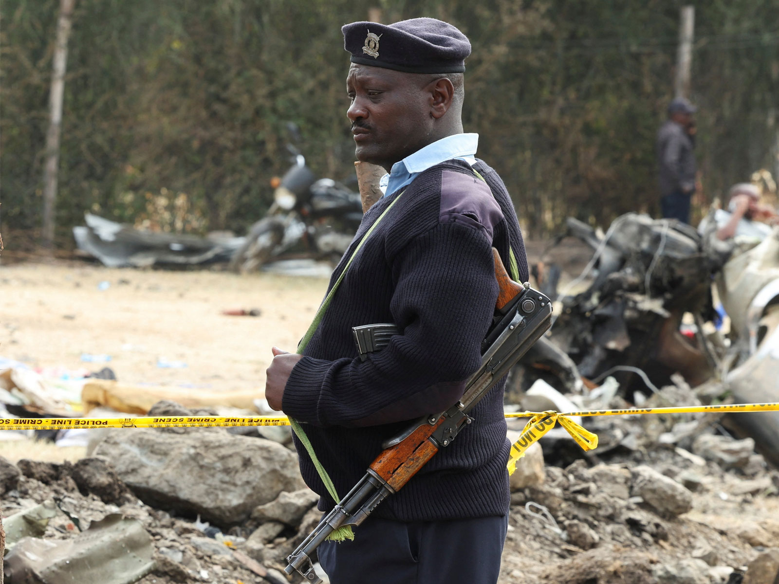 A policeman stands guard at the scene where a Cessna plane crashed into buildings in Nairobi, Kenya (File Photo/Reuters)