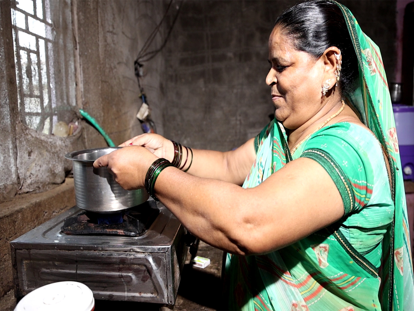 Woman works in kitchen using biogas (Photo/ANI)