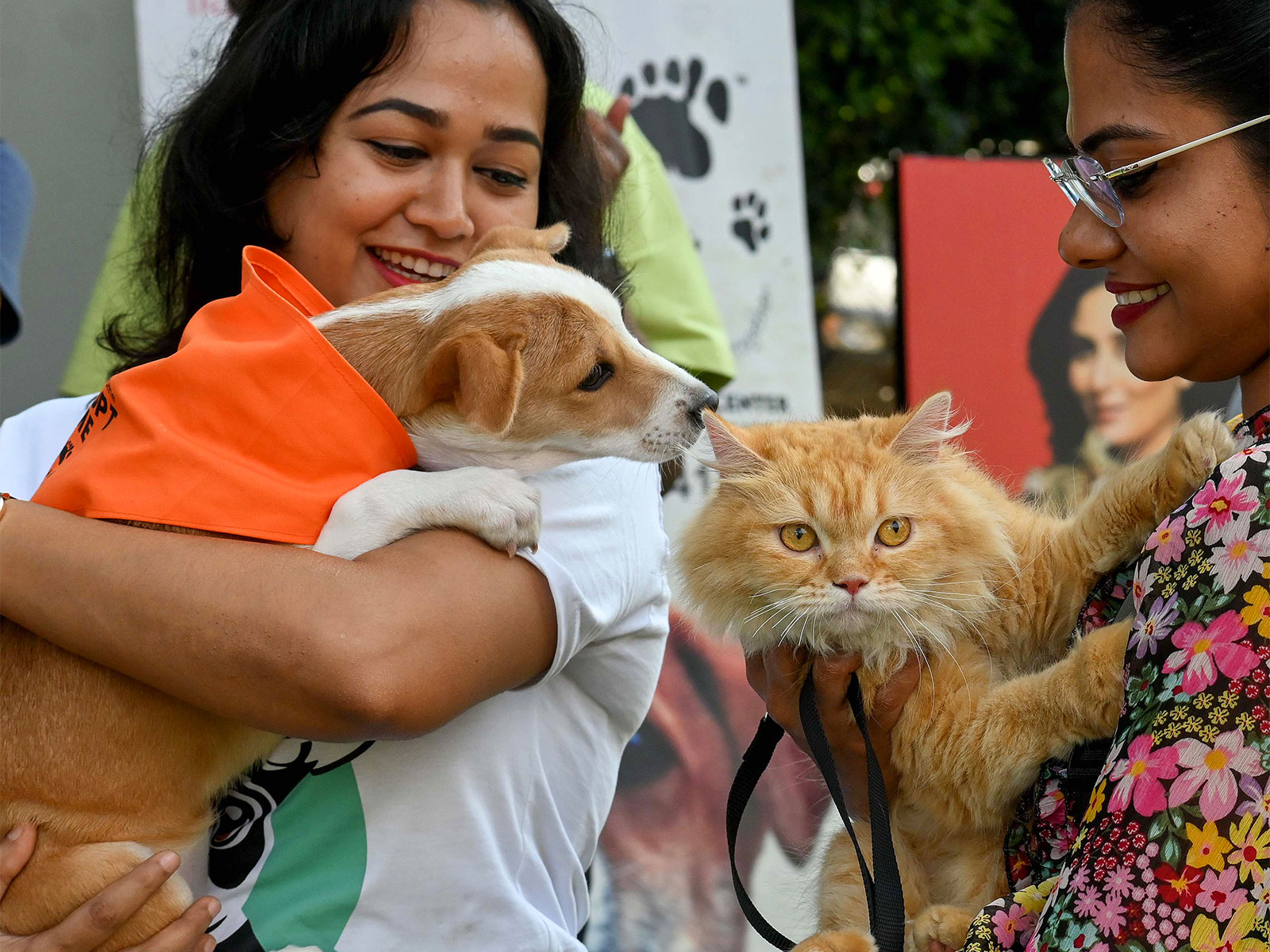 Owners hold their pets during a dog feed show in Bengaluru (Photo: ANI)