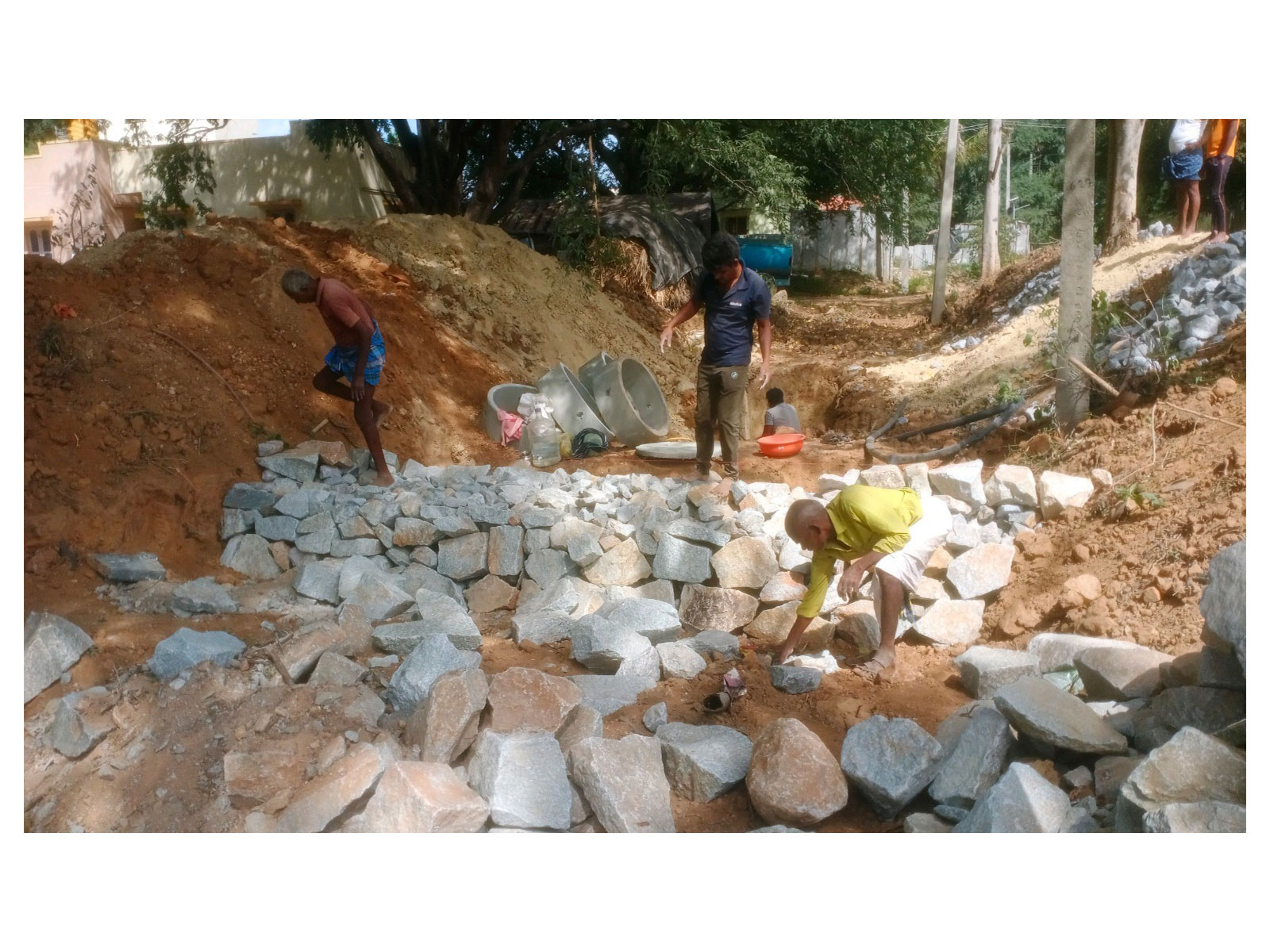Building boulder checks, slowing the rush of water to help it soak deep into the earth