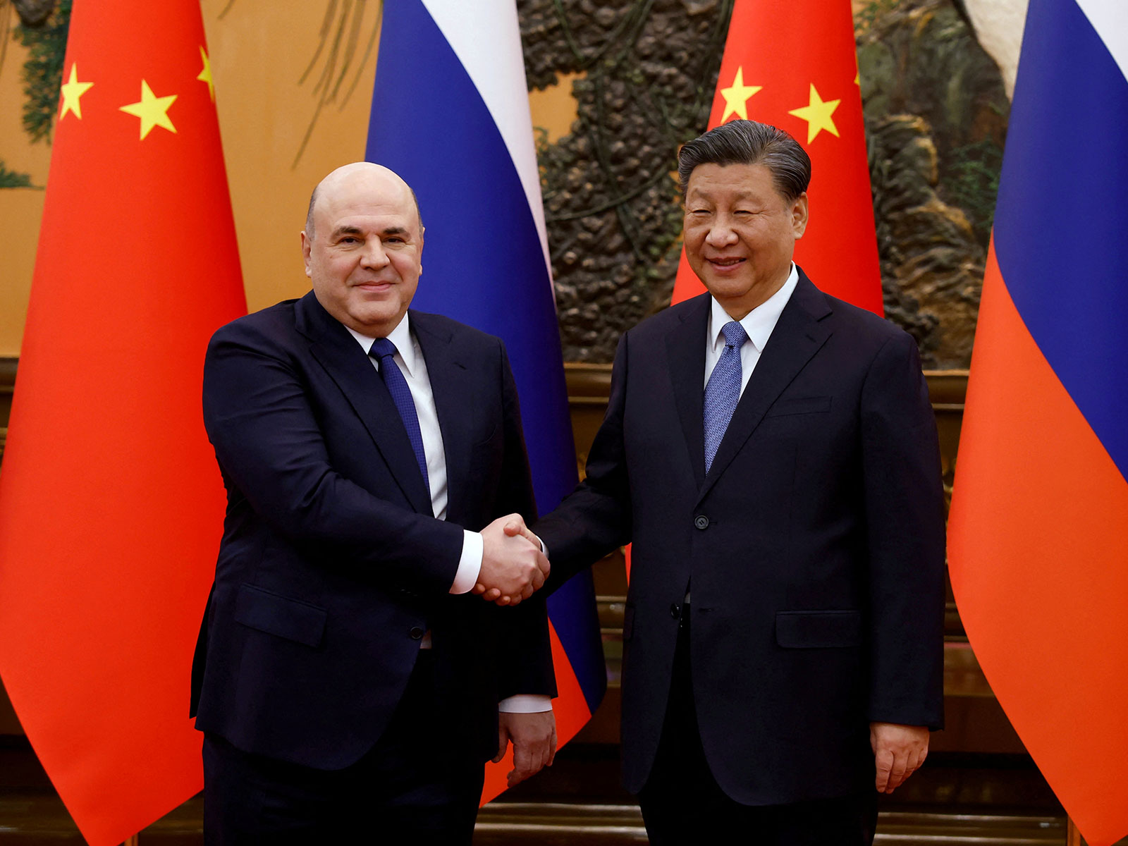 Russian Prime Minister Mikhail Mishustin with Chinese President Xi Jinping (Rght) during a meeting in Beijing in December 2023 (Photo/Reuters)