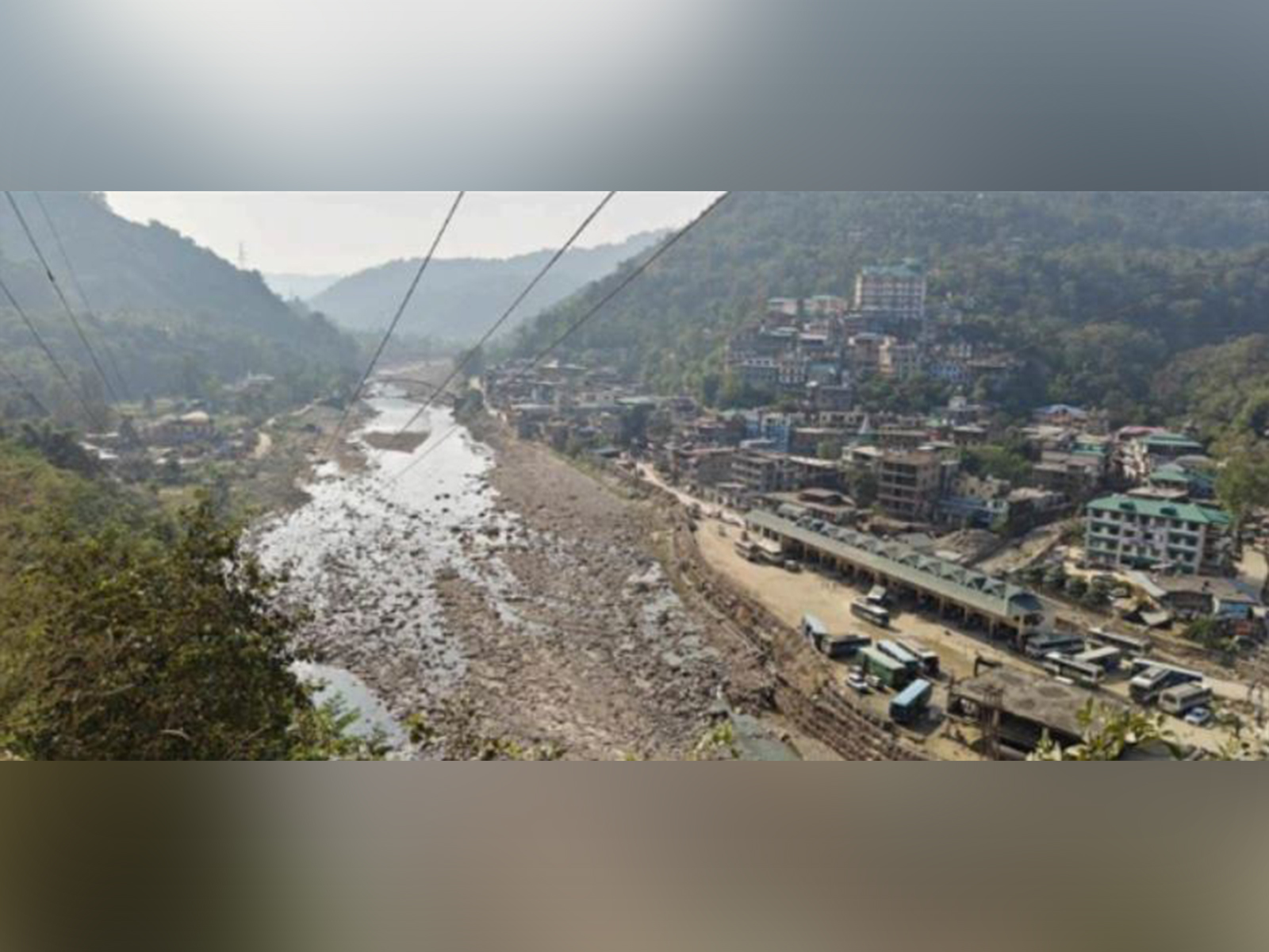 Aerial view of flood-hit Dharampur showing bus terminal and power sub-station, key sites for NbS pilot (Photo/Caritas India)