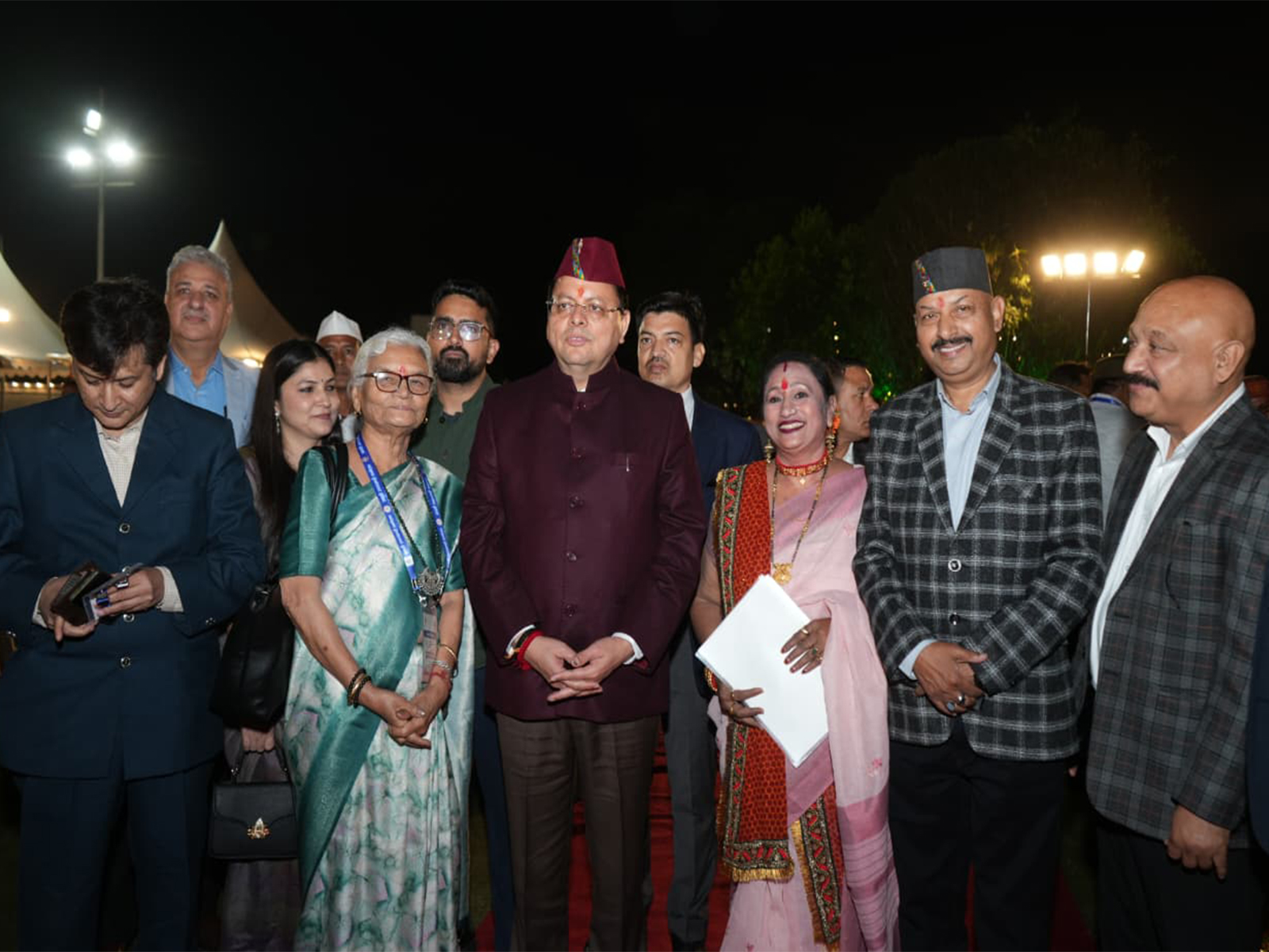 Uttarakhand CM Pushkar Singh Dhami with NRUs (Photo/ANI)