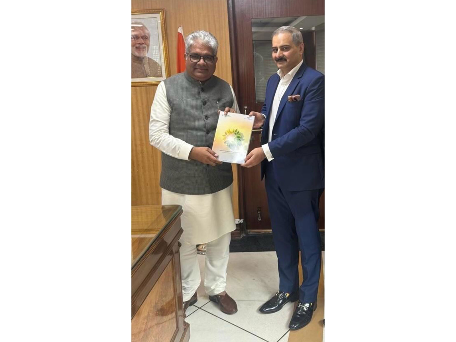 Image of Mr. Masood handing over the first copy of NCEF 3 to Shri Bupendar Yadav, Hon'ble Minister of Environment, Forest, and Climate Change.