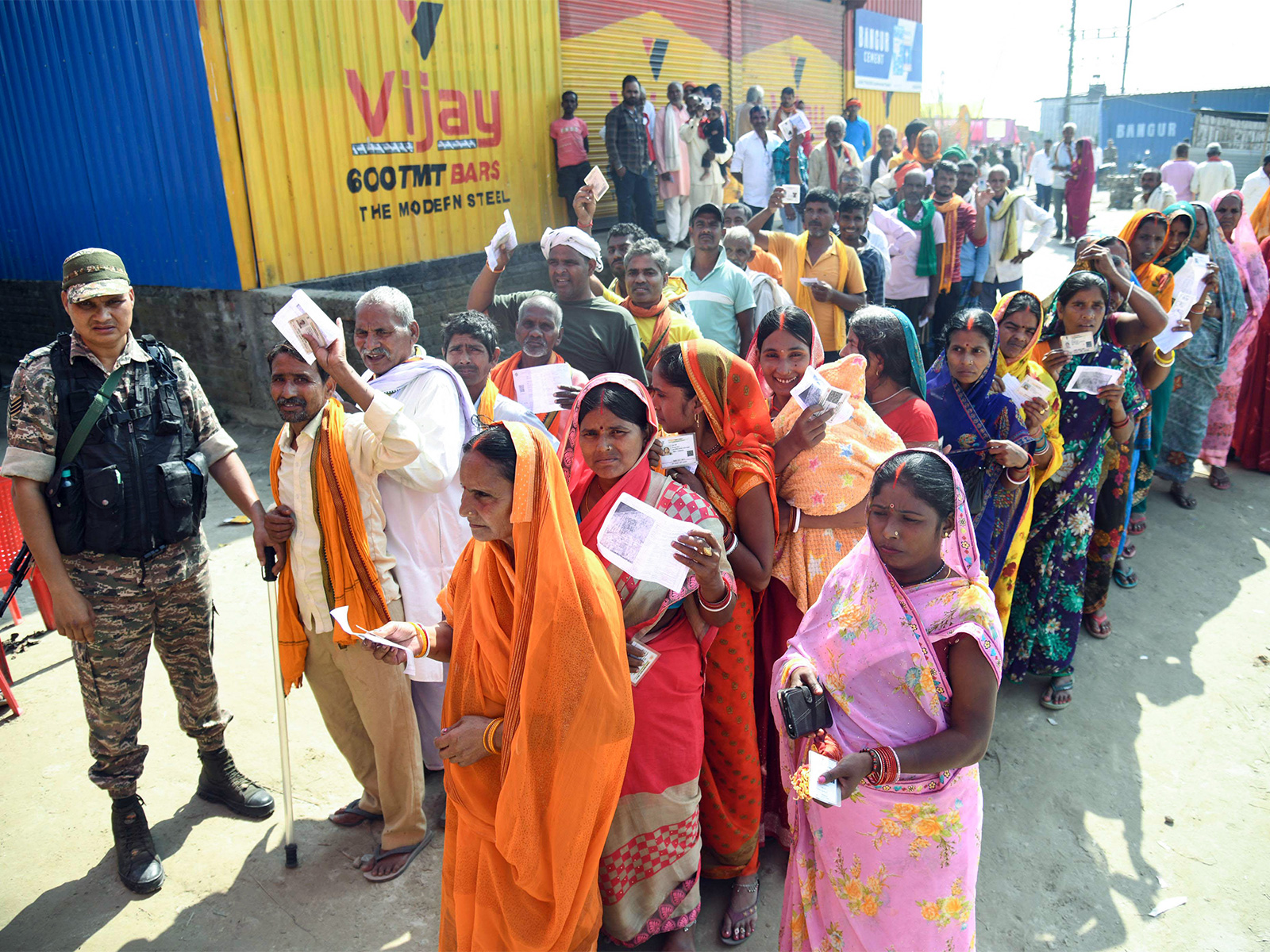 Voters wait in queues to cast their votes in Patna (Photo/ANI)