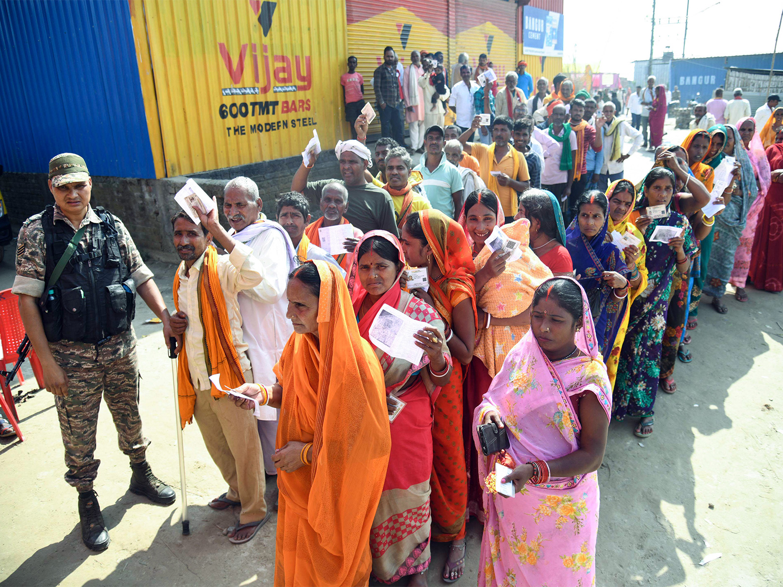 Voters wait in queues to cast their votes for the first phase of the Bihar Assembly election (File Photo/ANI)