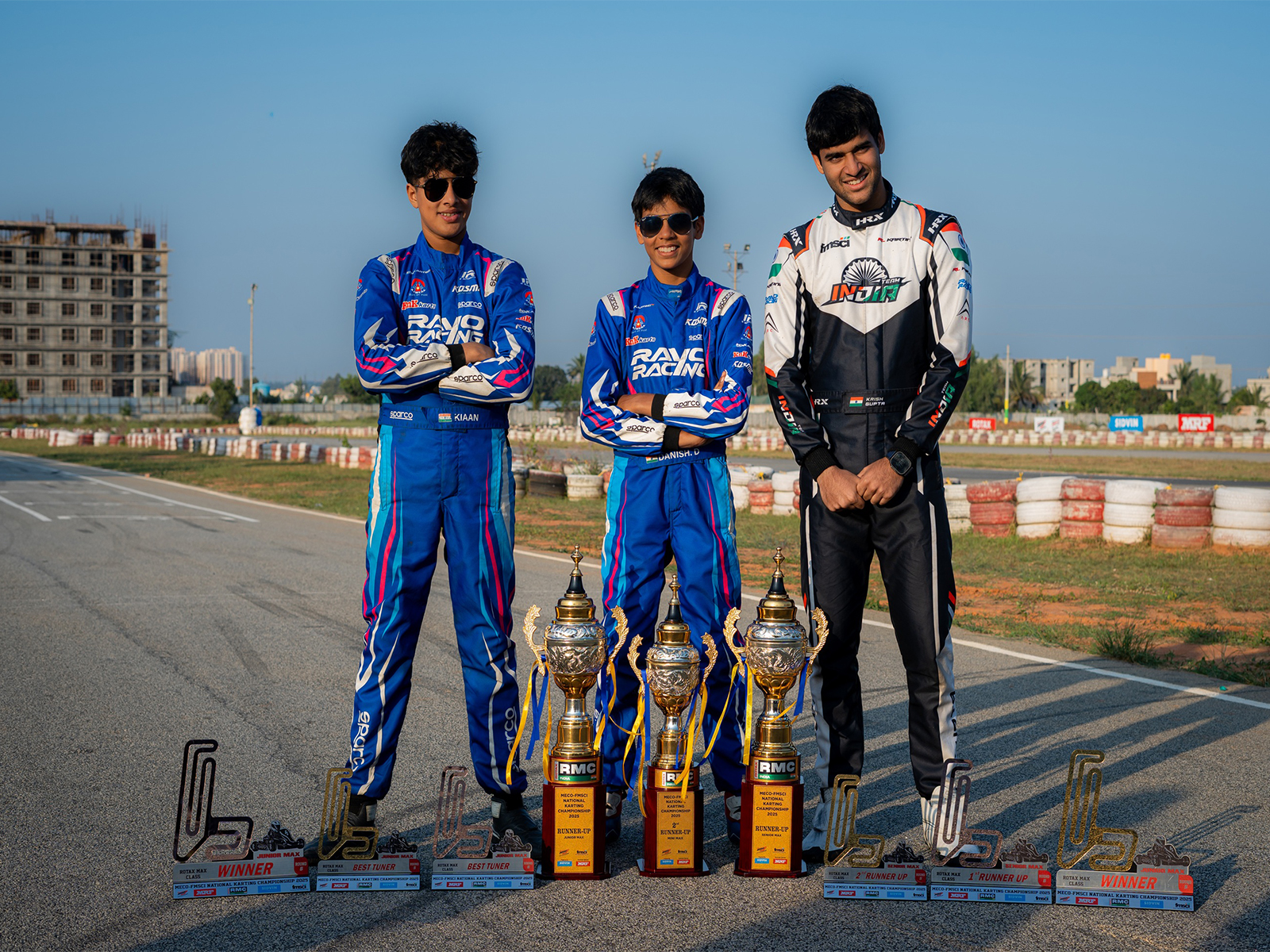 Kiaan Shah, Danish Dalmiya and Krish Gupta with their trophies at the end of National Karting Championship (Image: FMSCI)