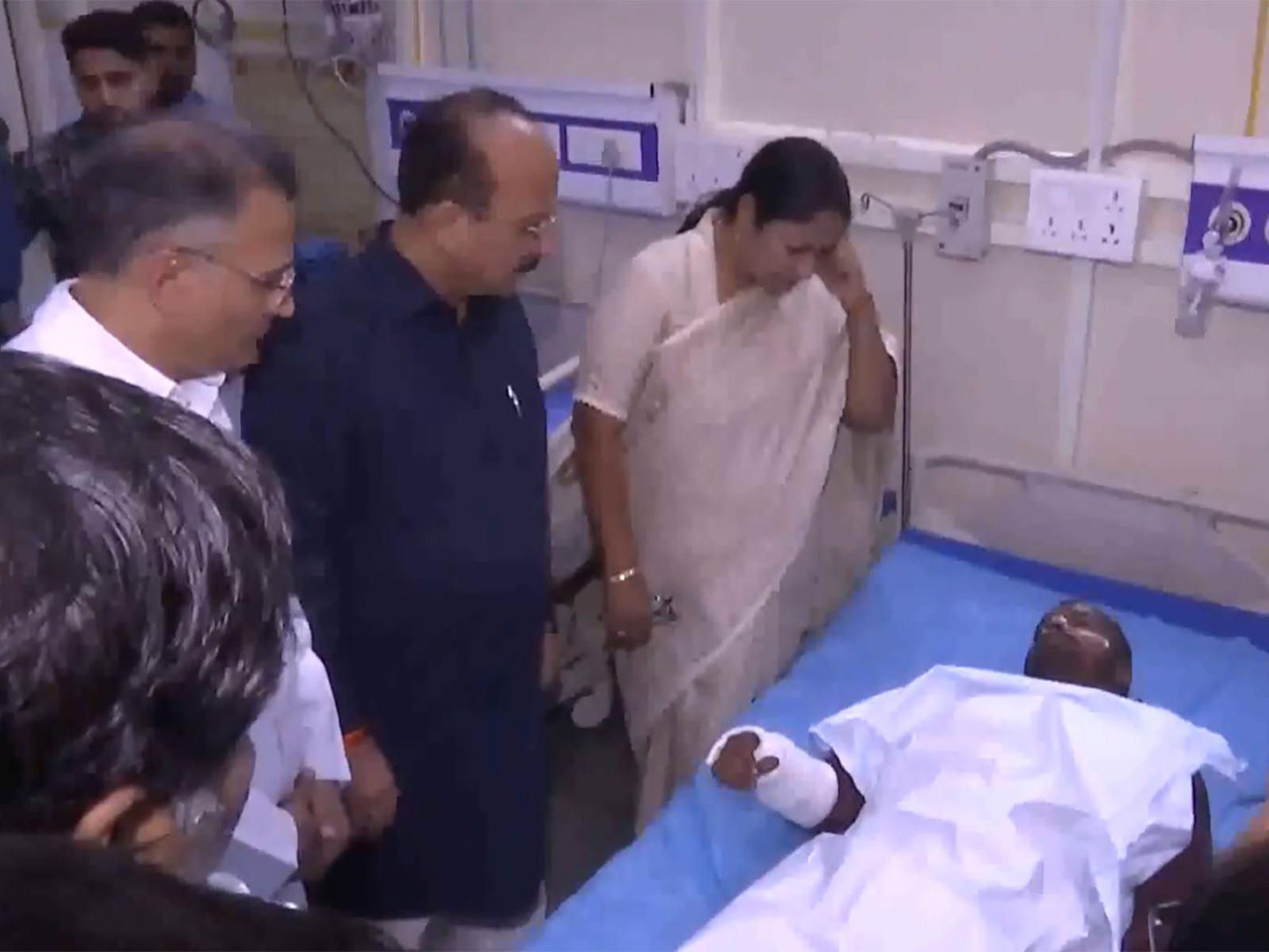 CM Rekha Gupta meeting an injured man at Lok Nayak Hospital (Photo/ANI)