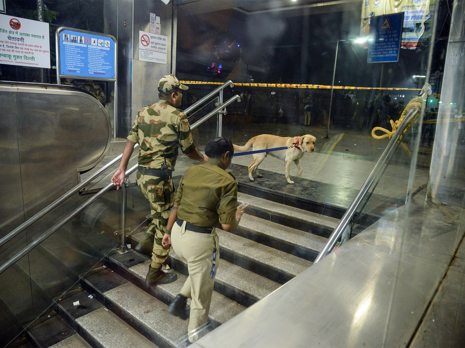 Security personnel with a sniffer dog at the Lal Quila metro station's gate no 1 (Photo/ANI)