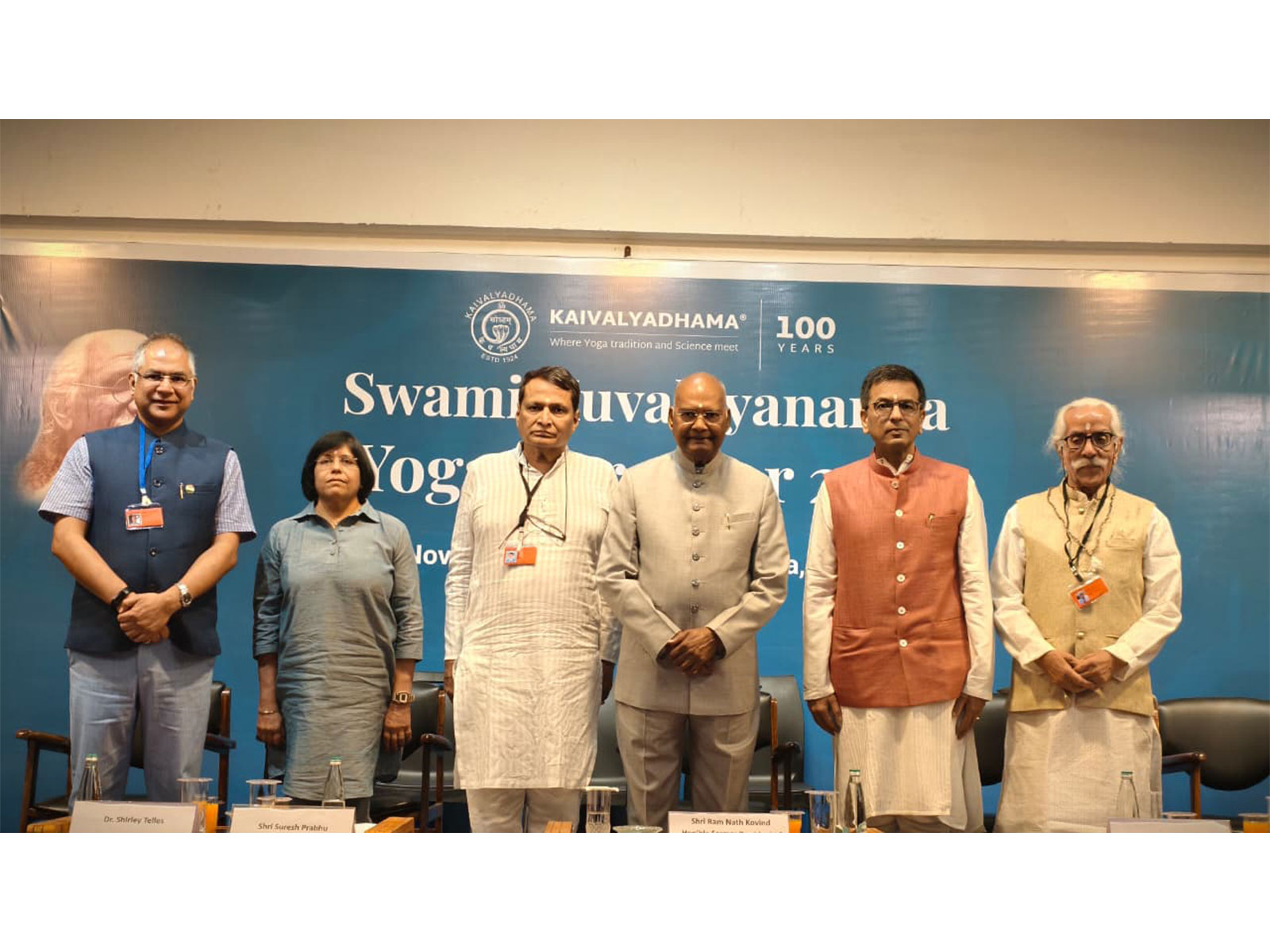 Standing left to right, Sh. Subodh Tiwari, Dr. Shirley Telles, Sh. Suresh Prabhu, Hon'ble Sh. Ram Nath Kovind, Dr. Justice D.Y. Chandrachud, Yogacharya Rambhau Khandwe