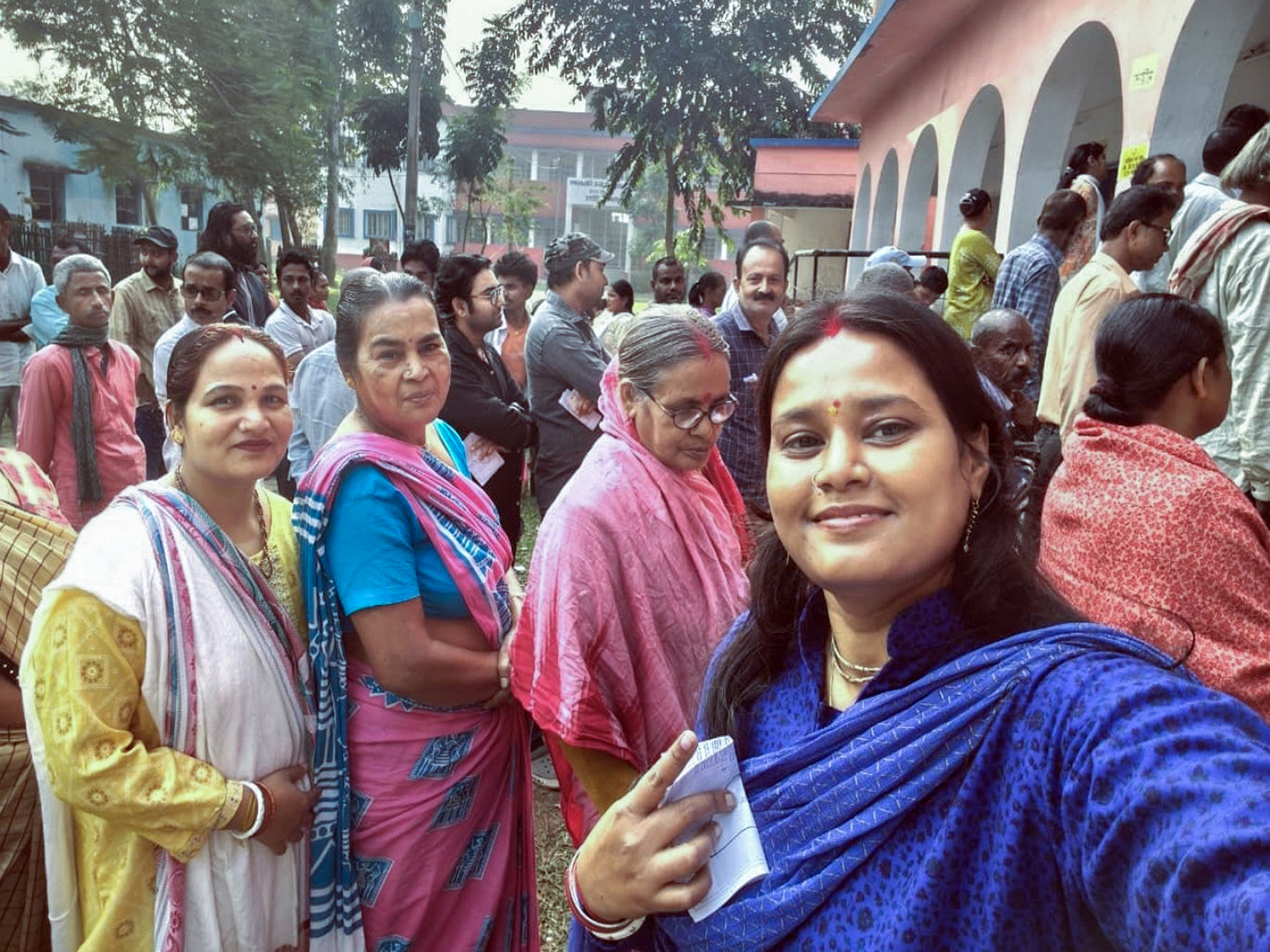 A voter clicks a selfie at a polling station during the second phase of the Bihar assembly elections, in Kishanganj (Photo/ANI)