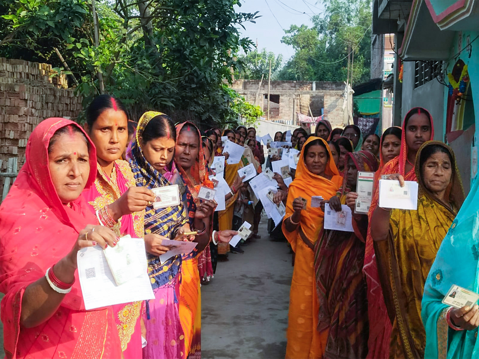 Women voters wait in a queue to cast their vote  in Katihar in the second phase of the Bihar assembly election (Photo/ANI)