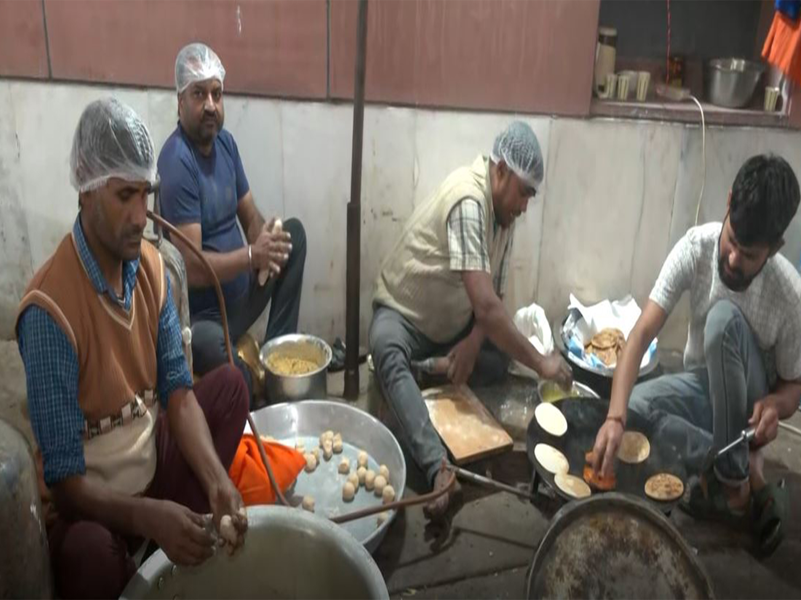 Confectioners prepare food for celebrations at BJP headquarters in Delhi (Photo/ANI)