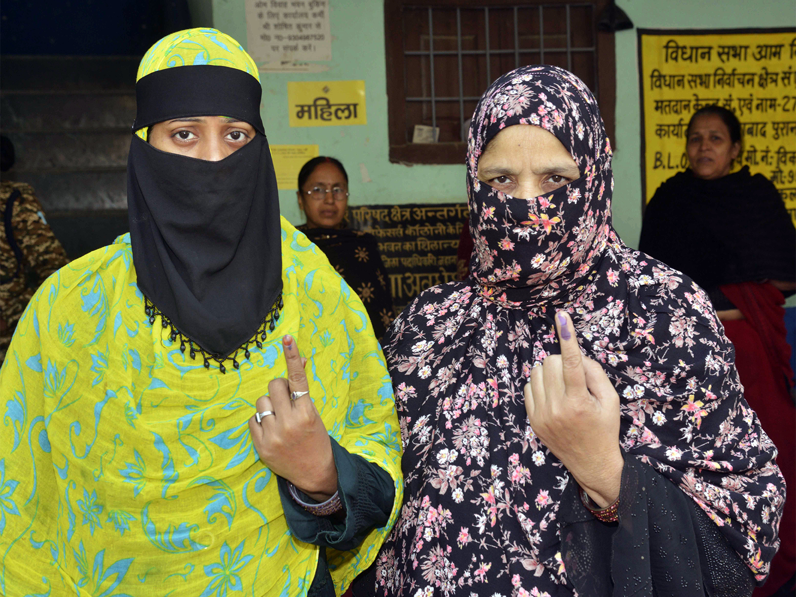 Women voters showing their fingers marked with indelible ink (Photo/ANI)