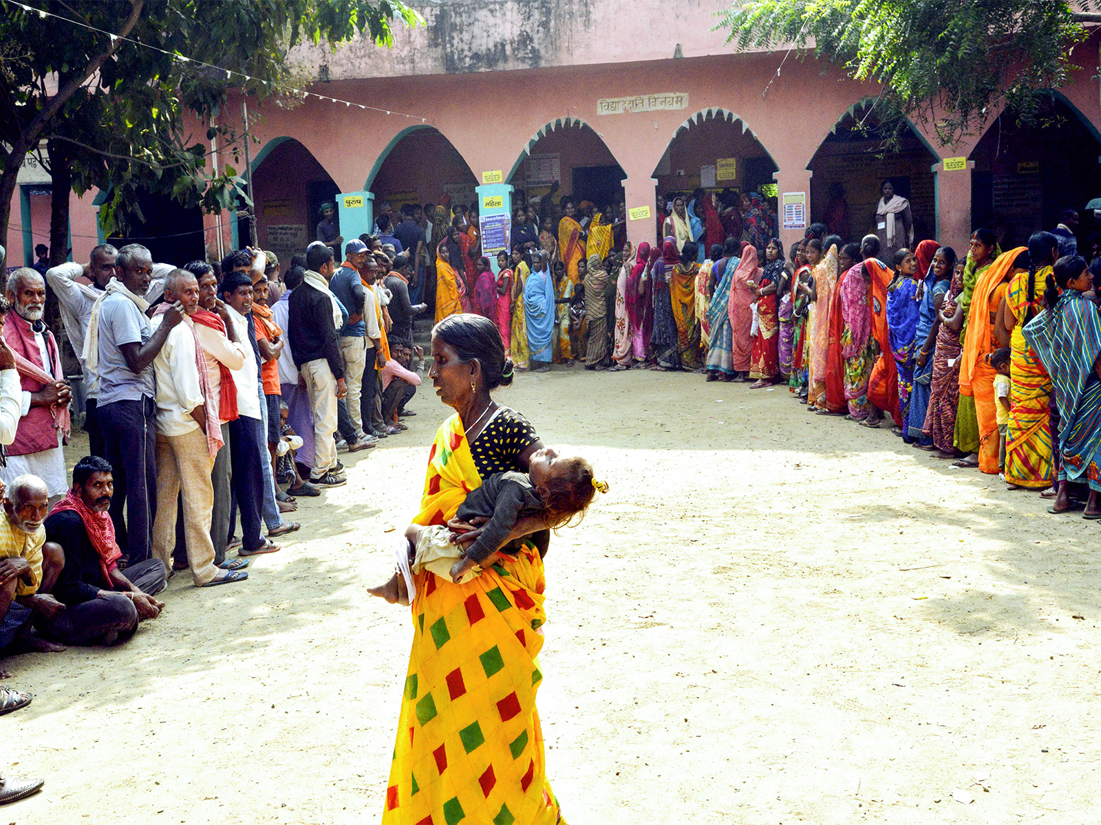 Voters wait in queues to cast their vote (Photo/ANI)