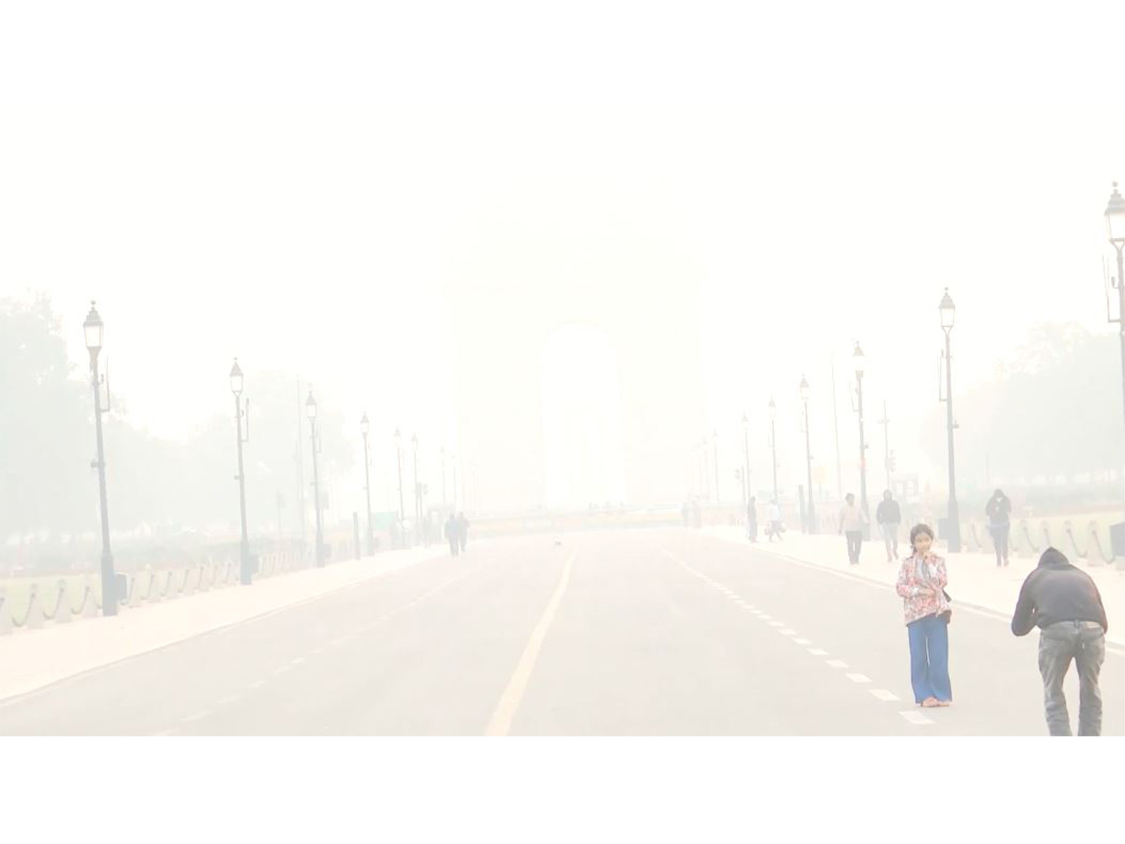 India Gate seems to disappear behind a layer of smog this morning. (Photo/ANI)
