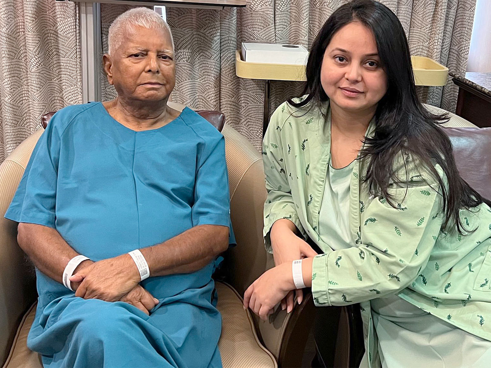 Lalu Prasad Yadav and daughter Rohini Acharya during her kidney transplant operation. (Photo/ANI)