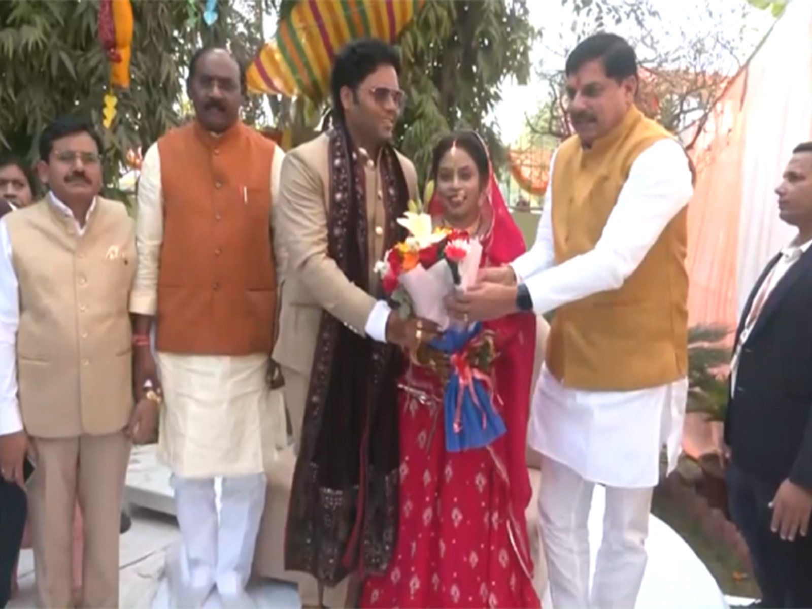 MP CM Mohan Yadav congratulating the newlywed couple (Photo/ANI)