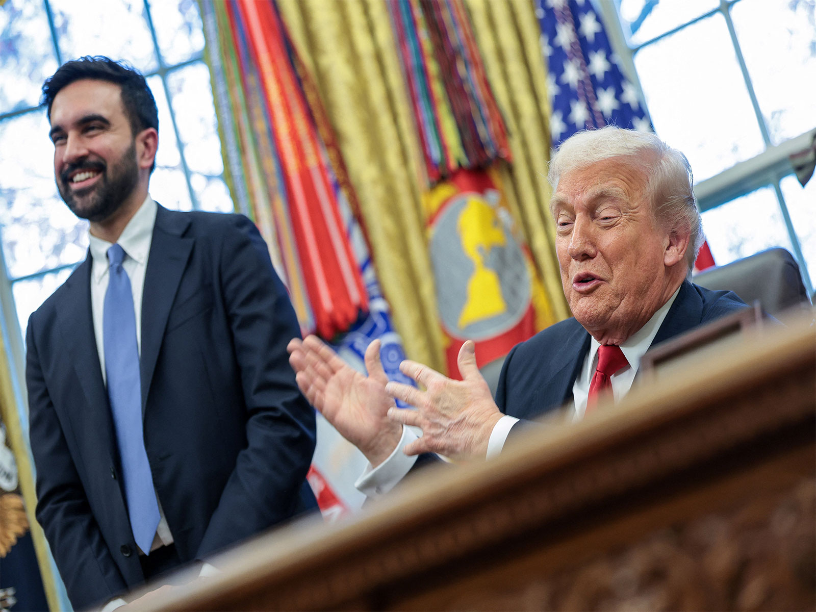 US President Donald Trump and New York City Mayor-elect Zohran Mamdani react as they speak to members of the media in the Oval Office (File Photo/Reuters)