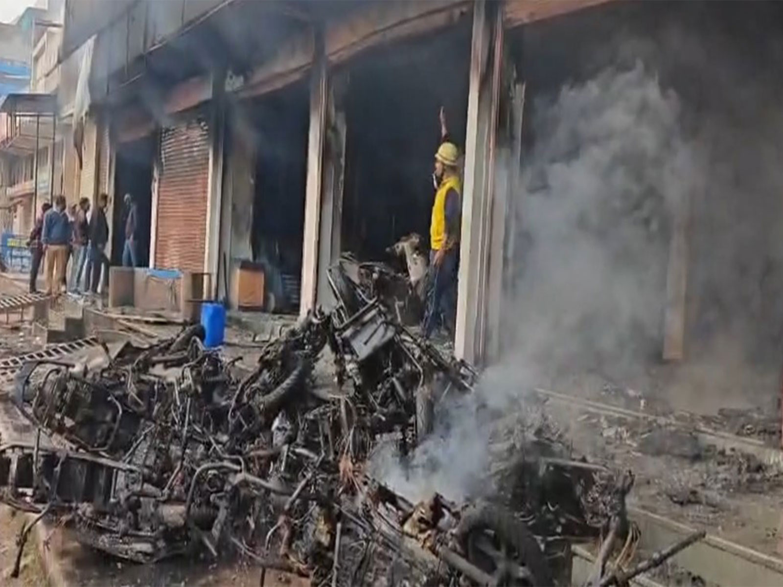 Burnt EV bikes outside the showroom in Kota, Rajasthan on Wednesday. (Photo/ANI)