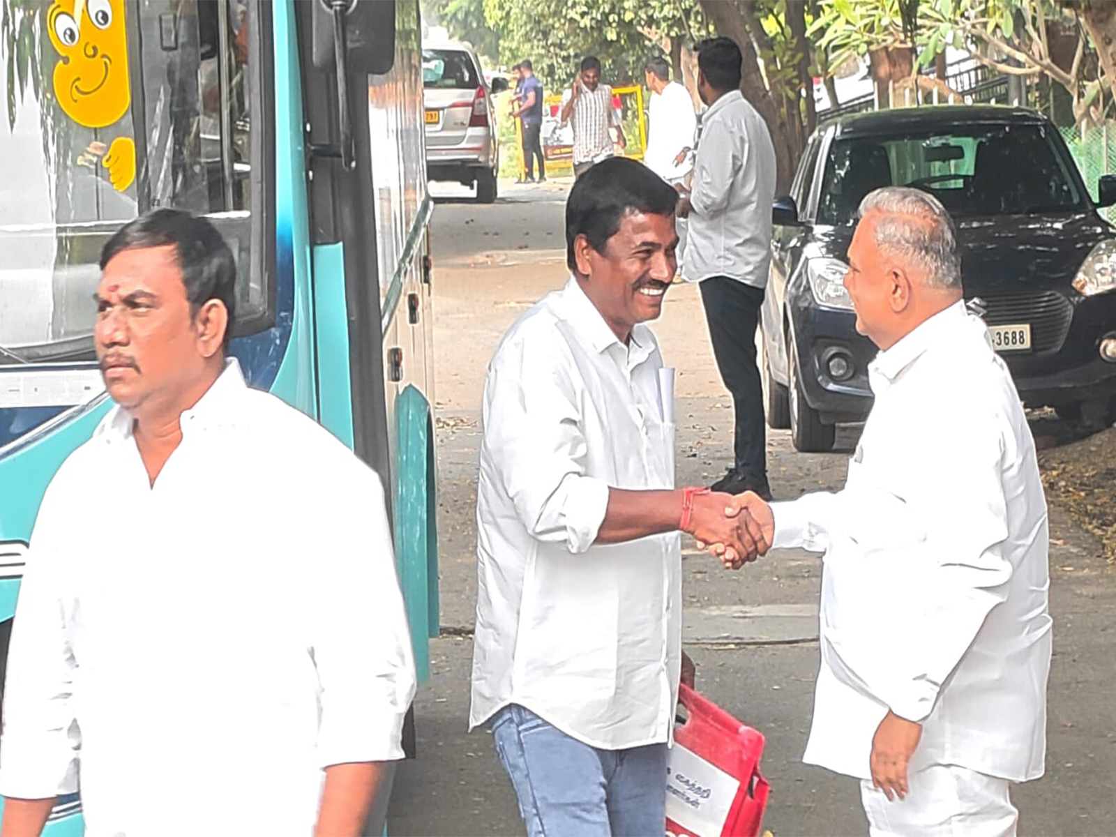 TVK General Secretary N Anand (right) welcoming KA Sengottaiyan supporters outside party office (Photo/ANI) 