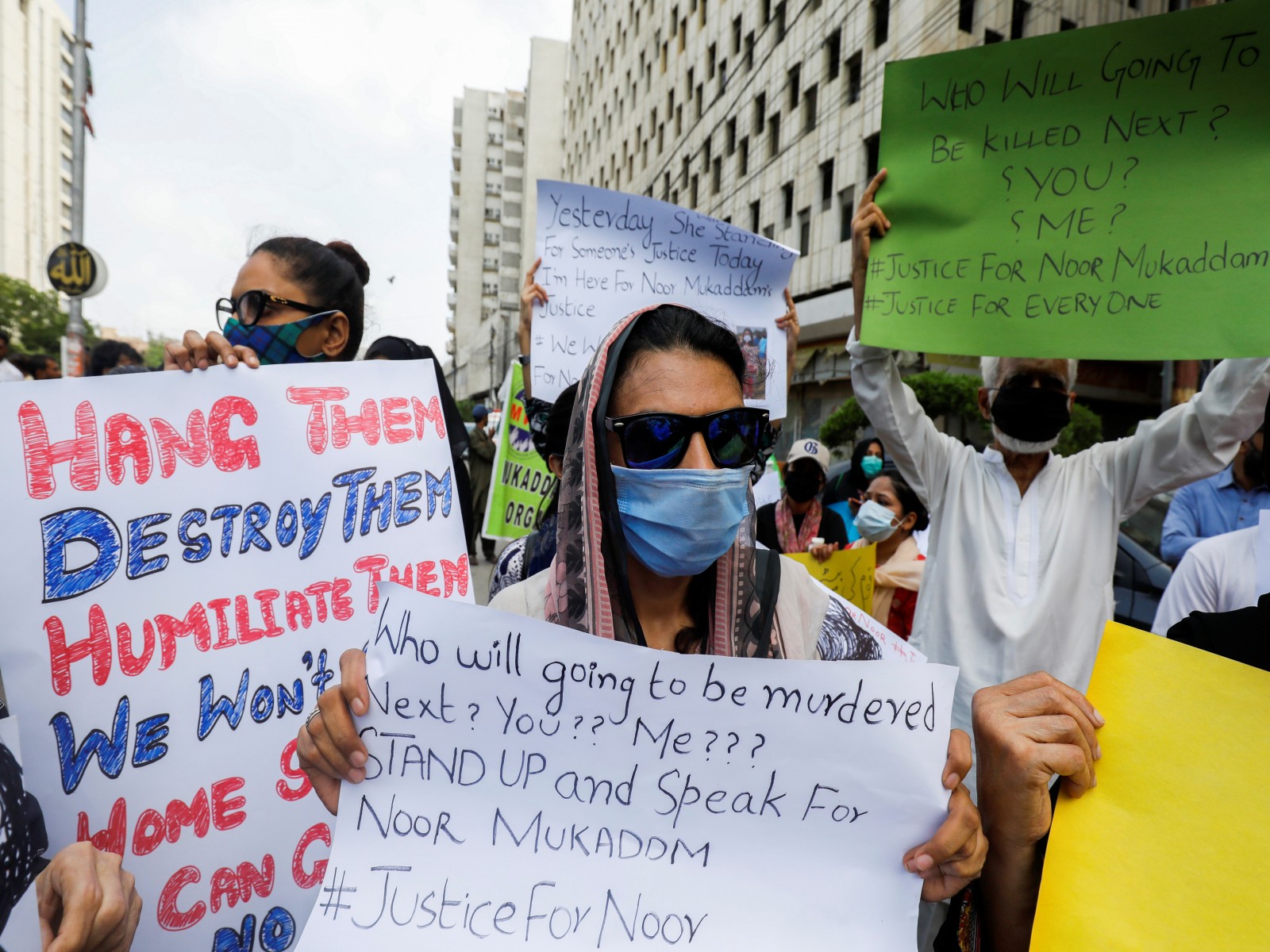 People carry signs against the killing of Noor Mukadam, 27, daughter of former Pakistani diplomat, and to condemn the violence against women and girls during a protest in Karachi, Pakistan July 25, 2021 (Photo/Reuters)