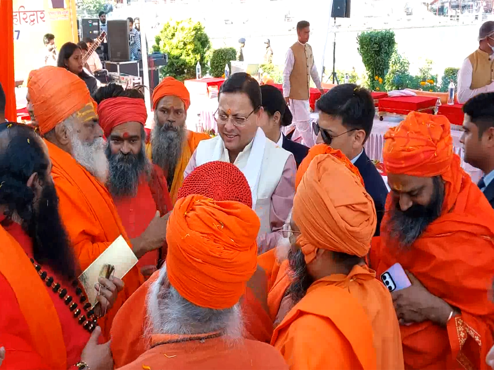 CM Dhami with Acharyas and saints of all 13 Akharas. (Photo/ANI)