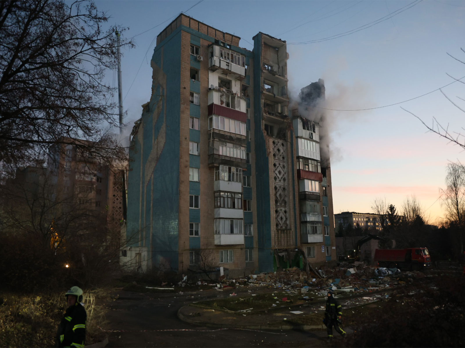 A damaged residential building smoulders after a Russian strike (File Photo/X/@ZelenskyyUa)