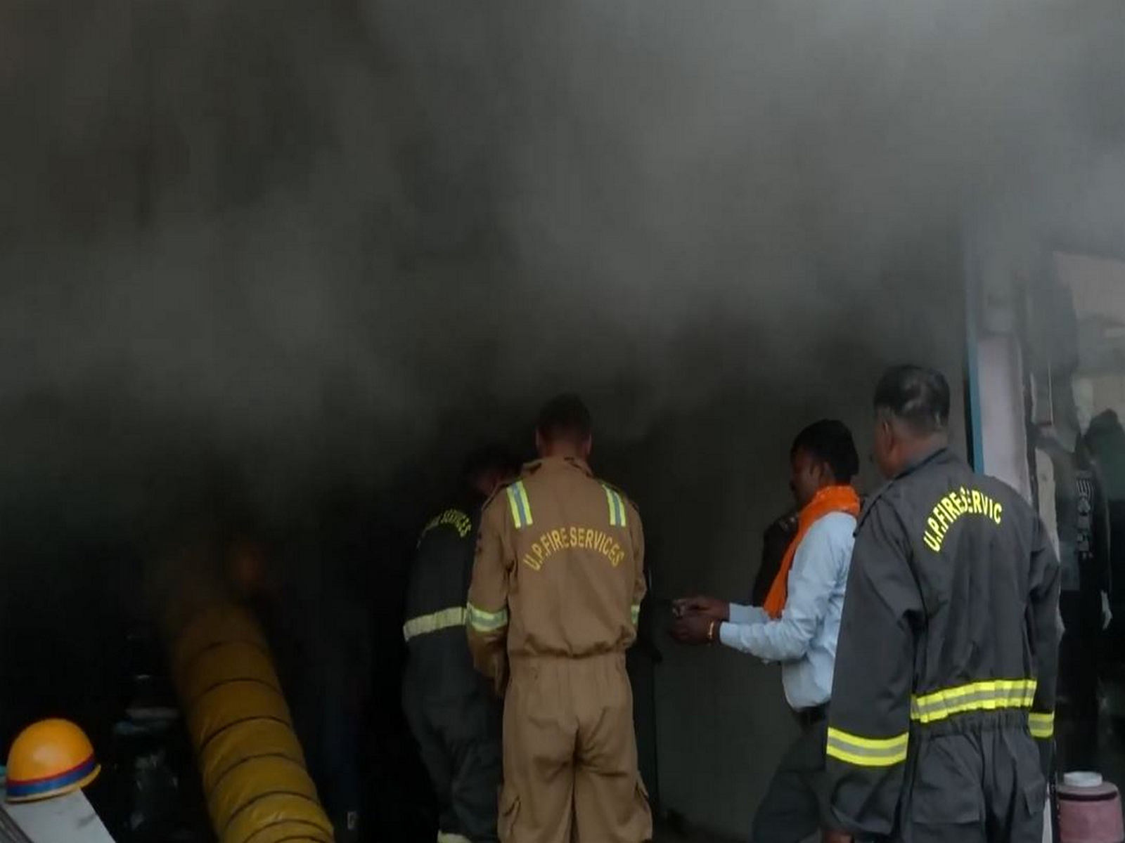 Firefighters controlling the blaze at the garments shop in Gorakhpur (Photo/ANI)