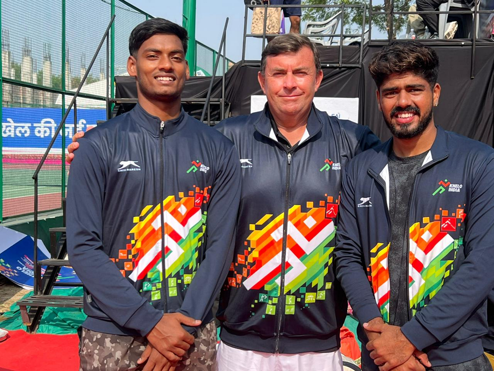 Tennis players Anshuman Singh (left) and Kabir Hans (right) with coach Todd Clark at the Sawai Man SIngh Stadium on Tuesday. (Photo: SAI Media)