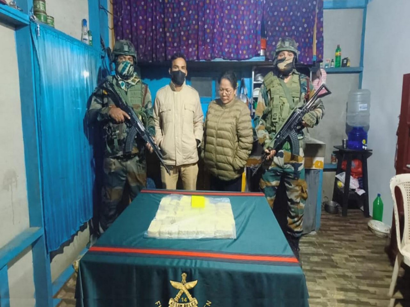 Assam Rifles Personnel with recovered Methamphetamine Tablets and Trafficker Zolianthangi (Photo/Assam Rifles)