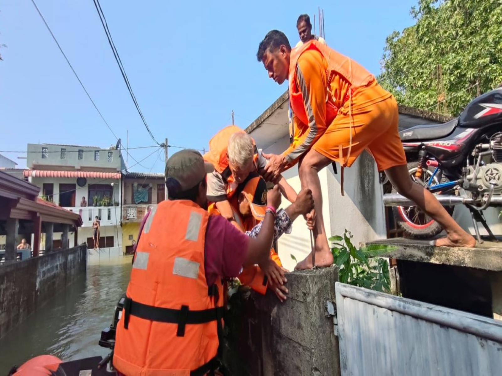 NDRF teams help evacuate people during flood rescue under Operation Sagar Bandhu. (Photo: X/@IndiainSL)