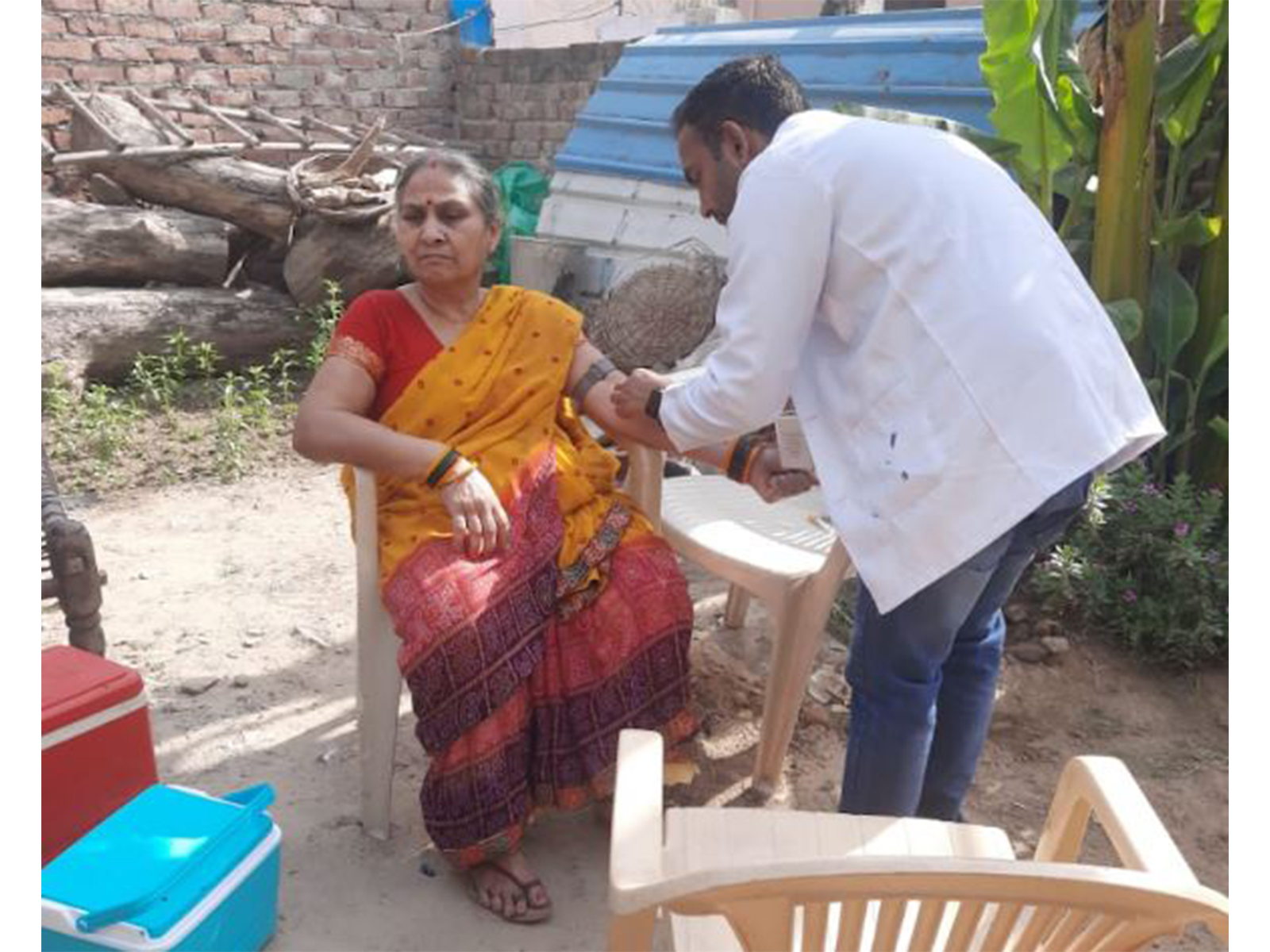 CCDC field staff collecting samples from a patient