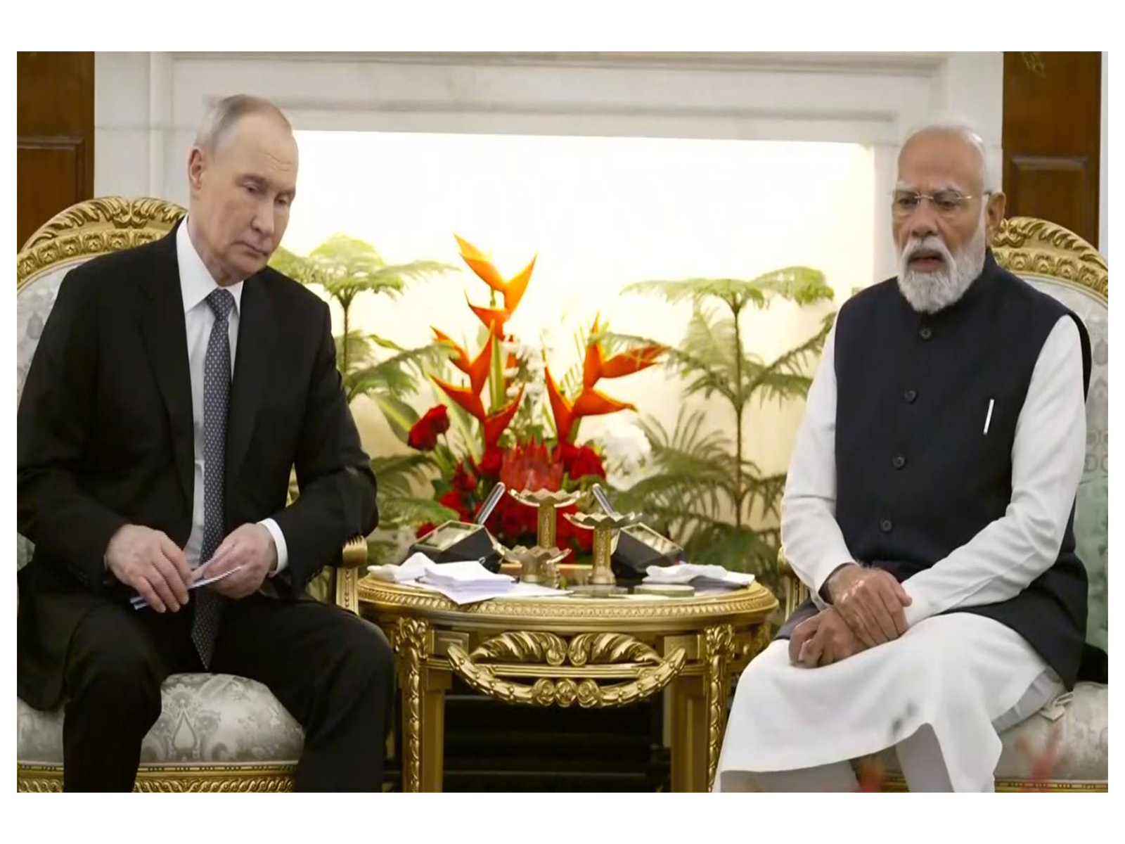 Russian President Vladimir Putin with PM Modi (Photo/ANI)