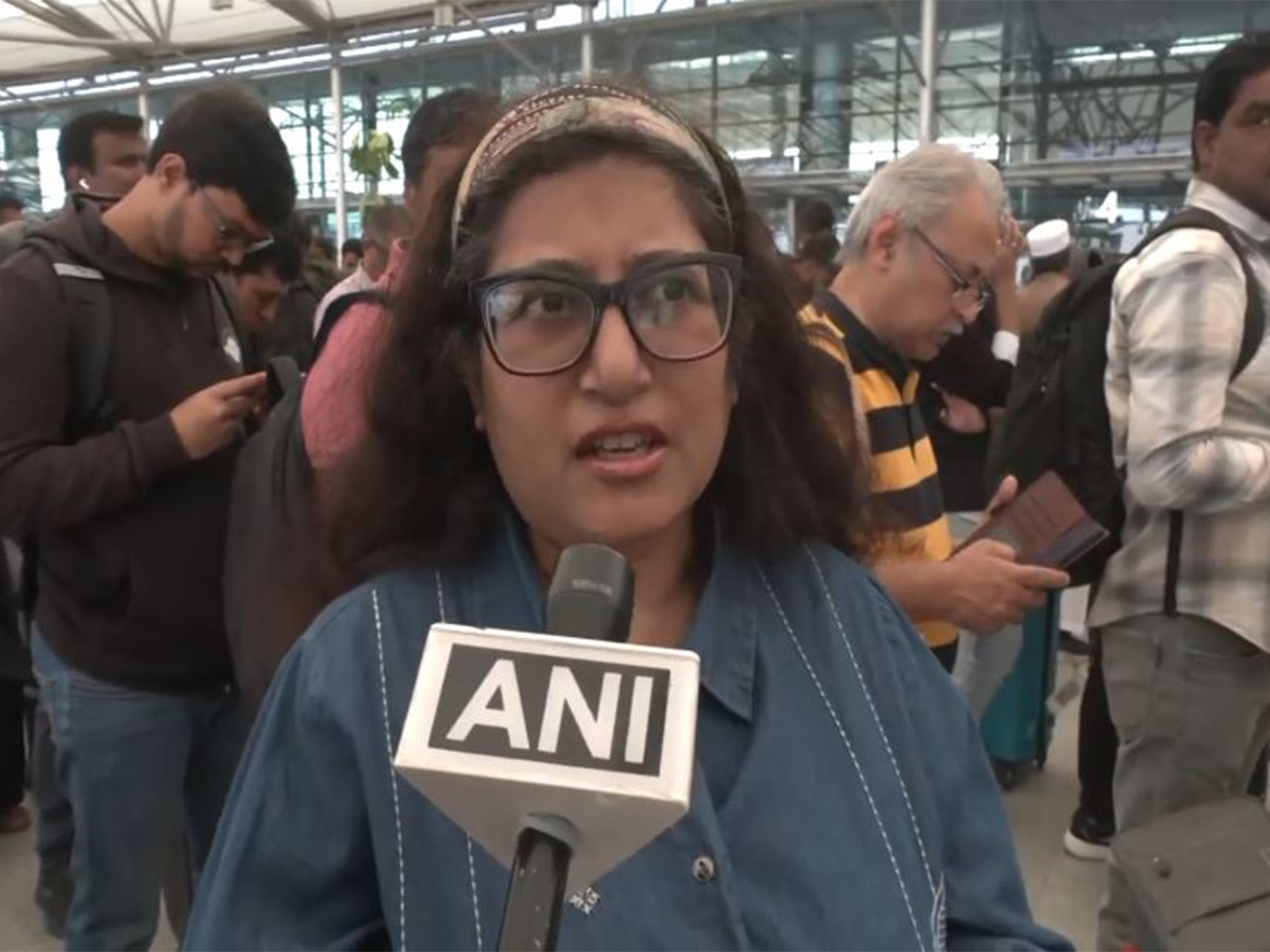 A stranded passenger at Hyderabad airport (Photo/ANI)