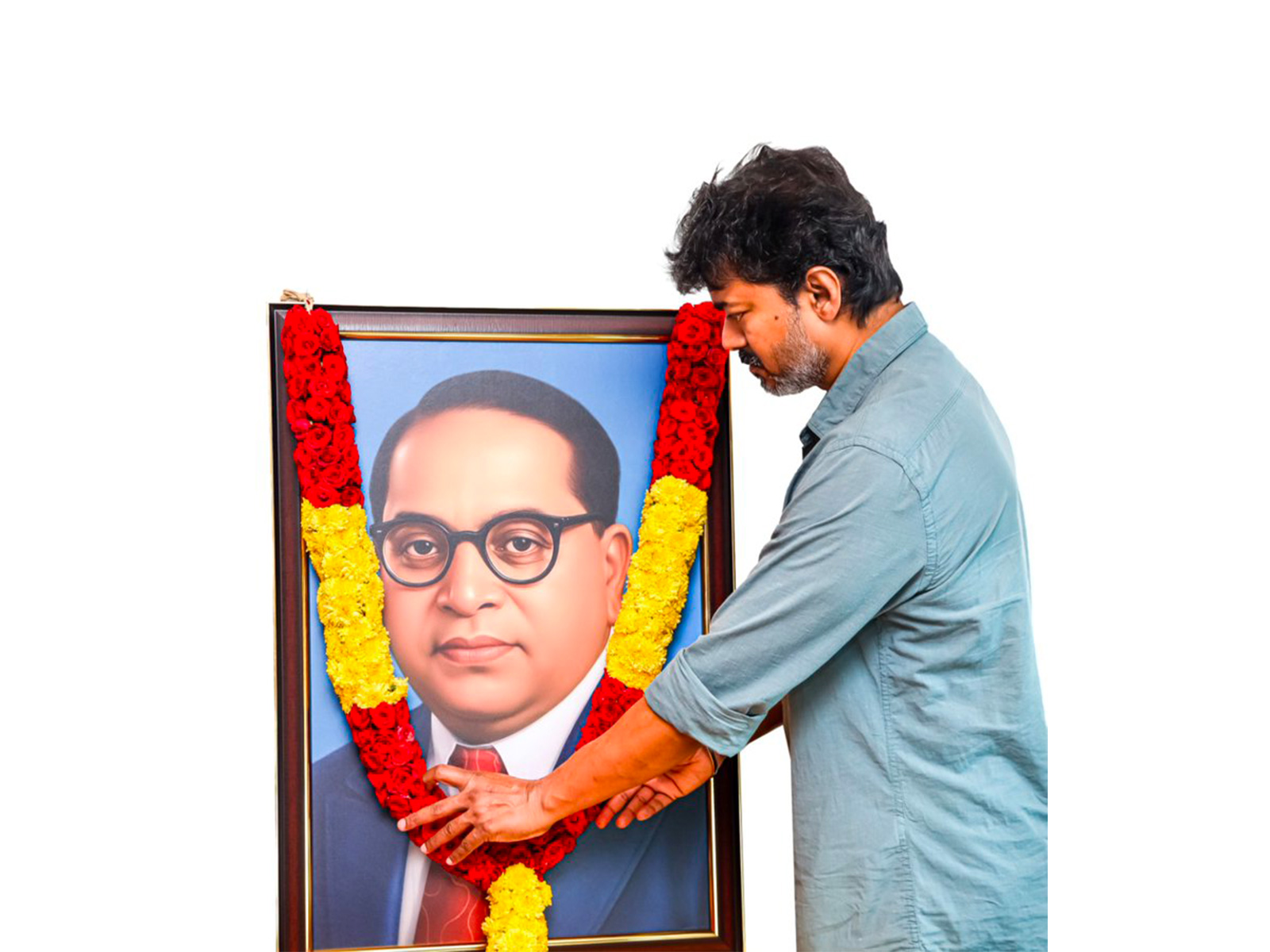 TVK party leader Vijay Thalapathy garlanding B.R. Ambedkar portrait (Photo/X/@TVKVijayHQ)
