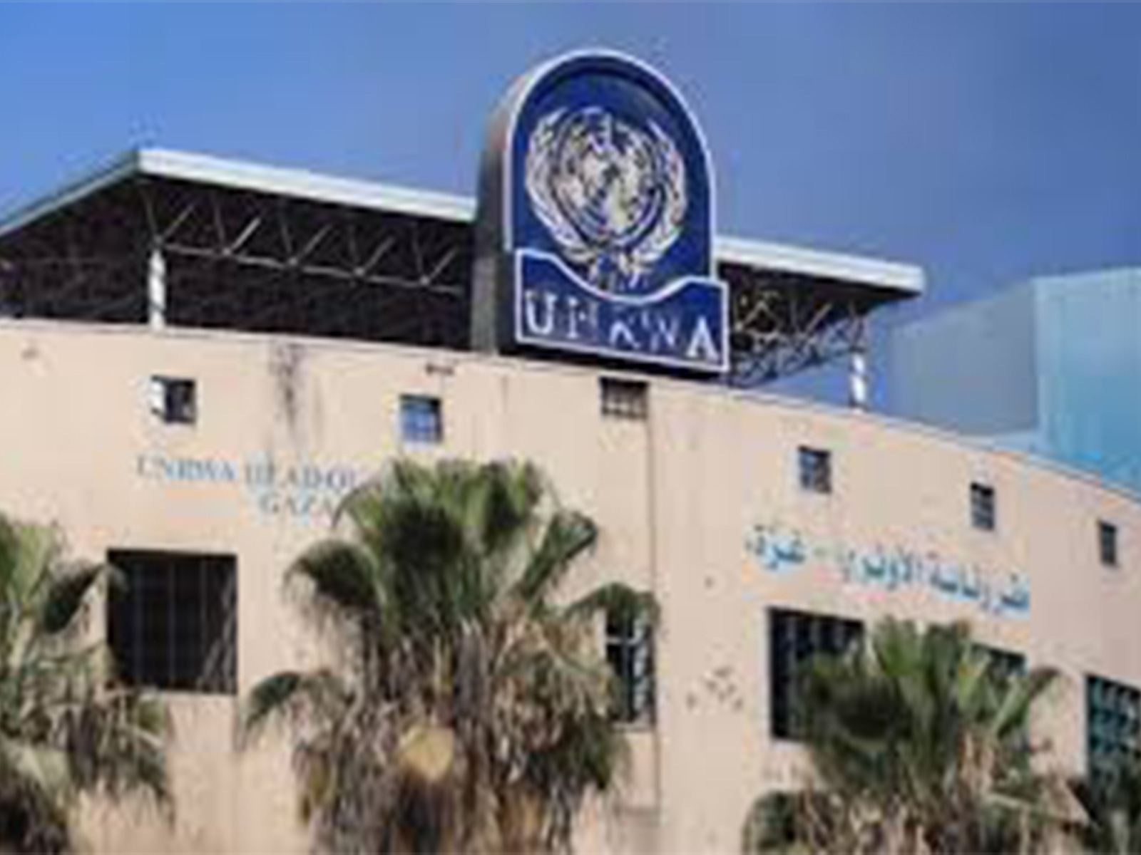 A damaged sign is seen at the UNRWA headquarters. (Photo/Reuters)