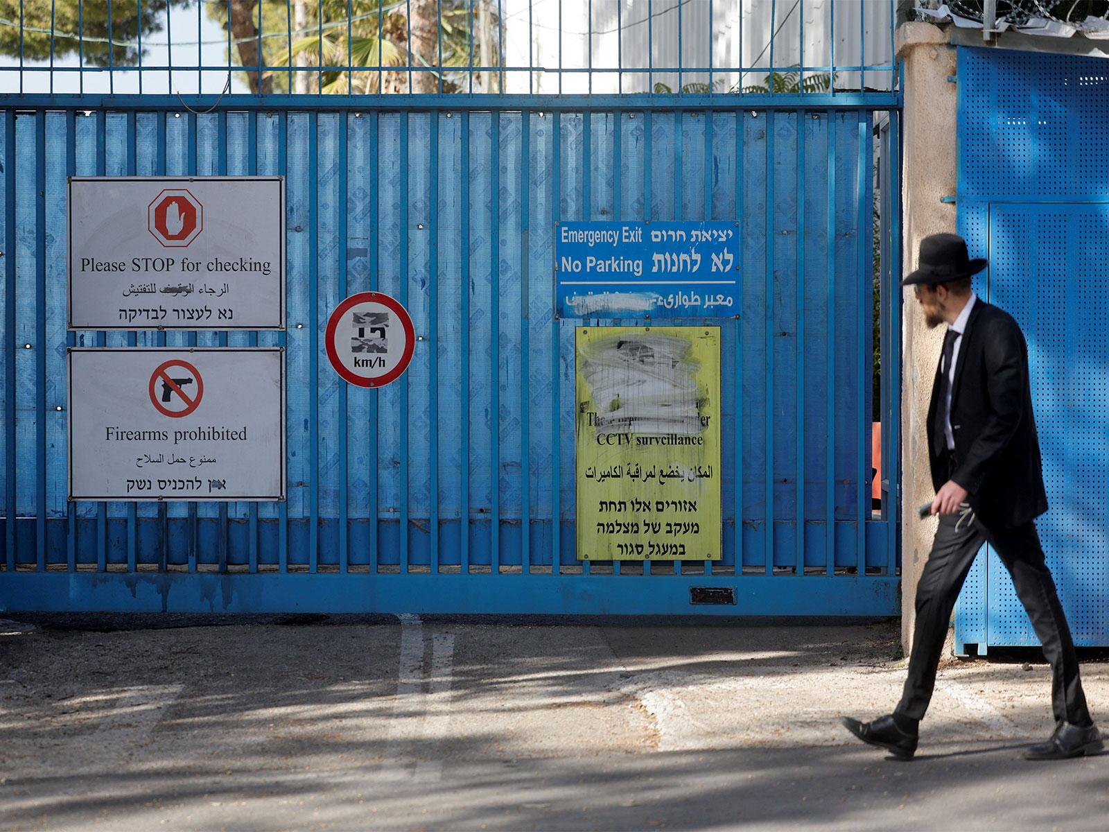 Signs are displayed at the gate of the United Nations Relief and Works Agency for Palestine Refugees (UNRWA) headquarters (Photo/Reuters)