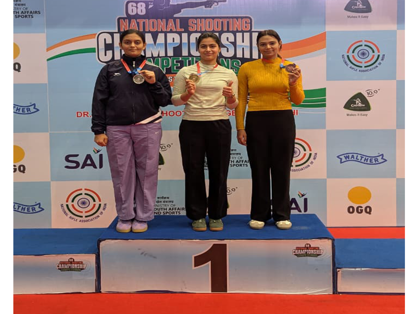 Divya T.S., Manu Bhaker (In centre) and Anjali Choudhary after winning medal at the 68th National Shooting Championship Competitions (Image: NRAI media)