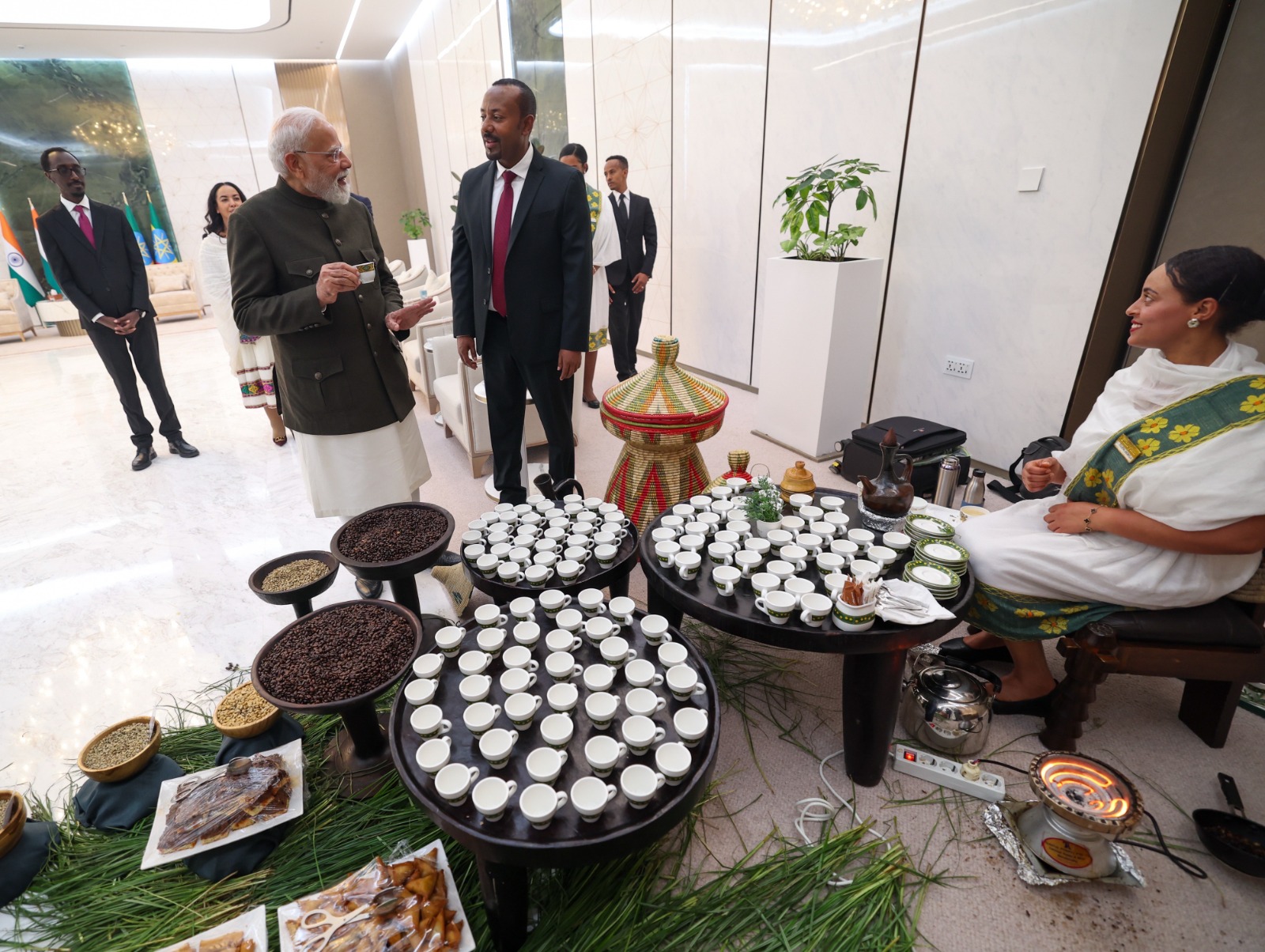 PM Modi participating in traditional Ethiopian coffee ceremony with Ethiopian counterpart Abiy Ahmed Ali at Addis Ababa airport. (Photo: X/@narendramodi) (Photo/ANI)