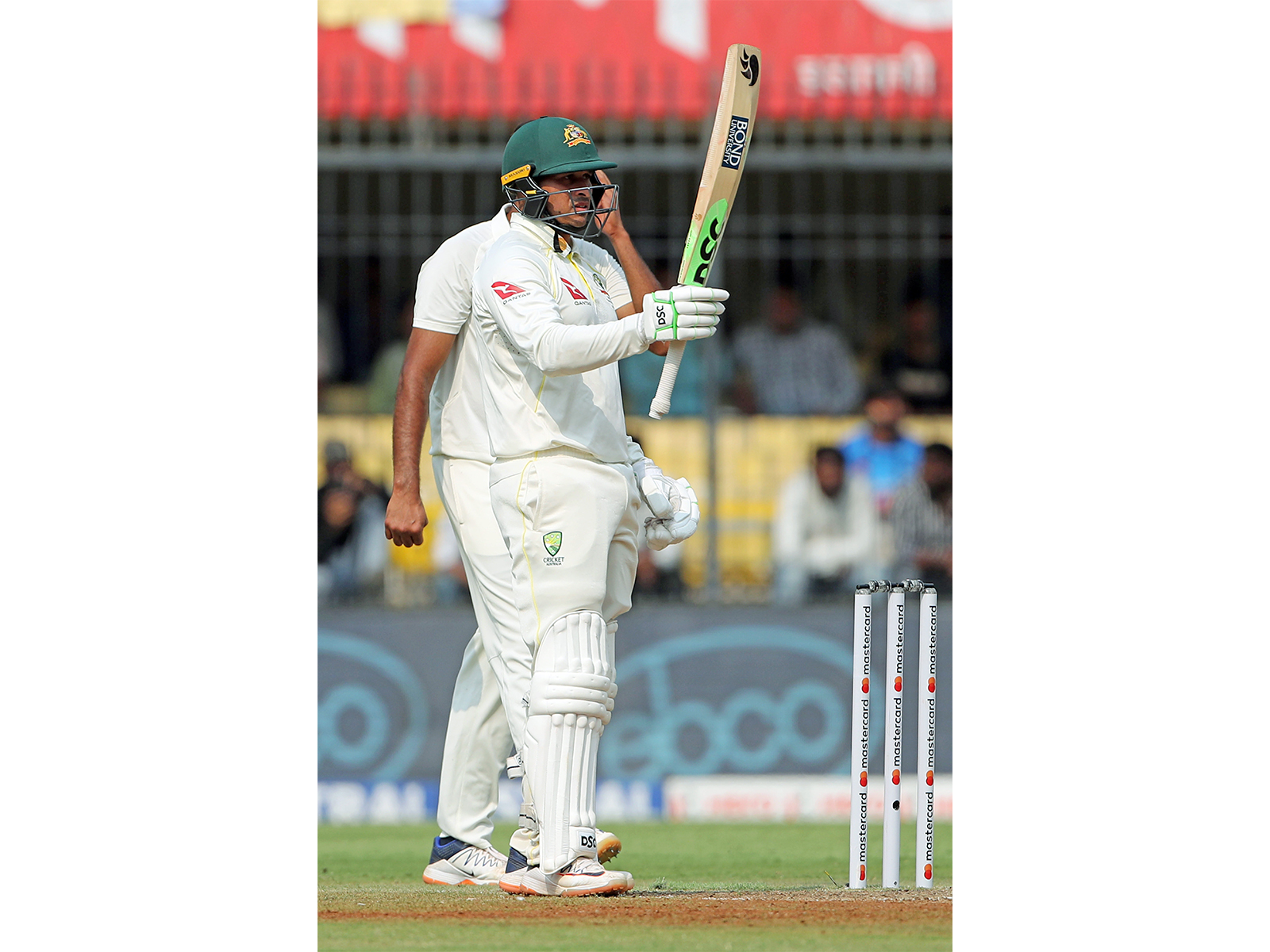 Usman Khawaja raises his bat after completing his fifty. (Photo/ANI)