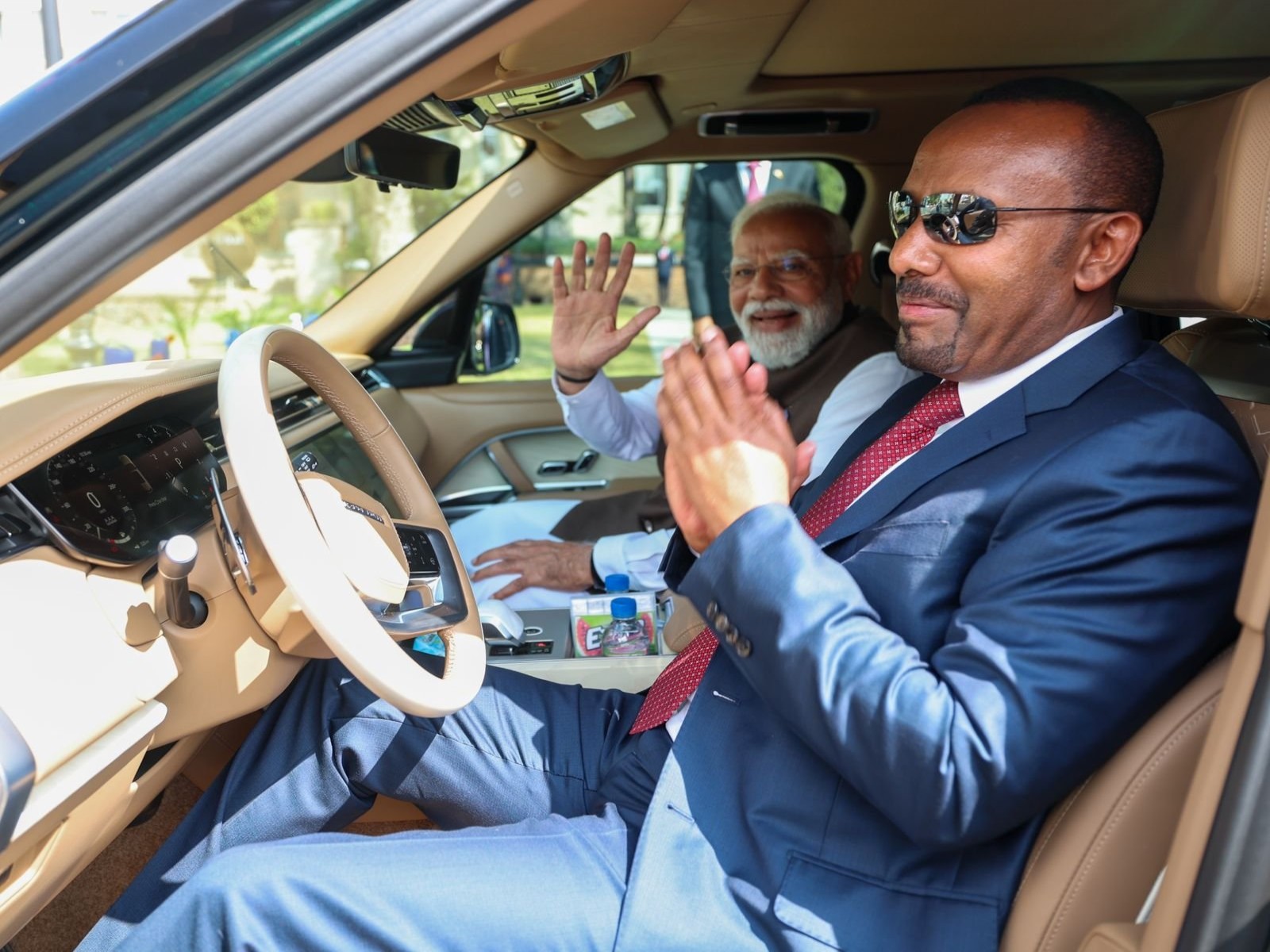 Prime Minister Narendra Modi waves as Ethiopian Prime Minister Abiy Ahmed Ali drives him to the airport in Addis Ababa. (Photo: X/@narendramodi)