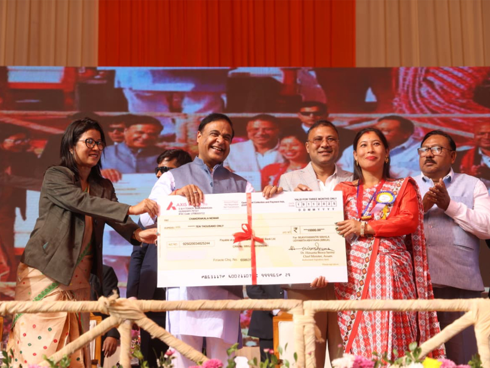 Assam CM Hemant Biswa Sarma hands over cheques under MMUA (Photo/ANI)
