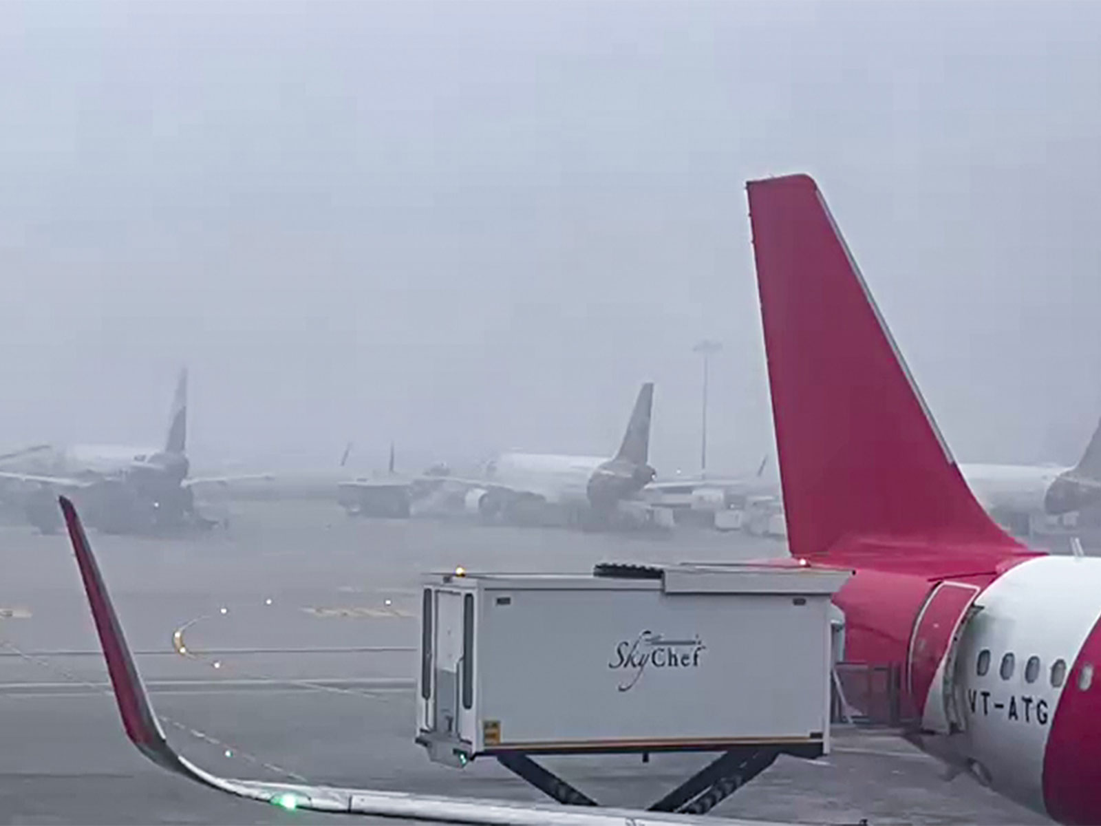 Aicraft await take-off at runway due to fog and low visibility (Photo/ANI)