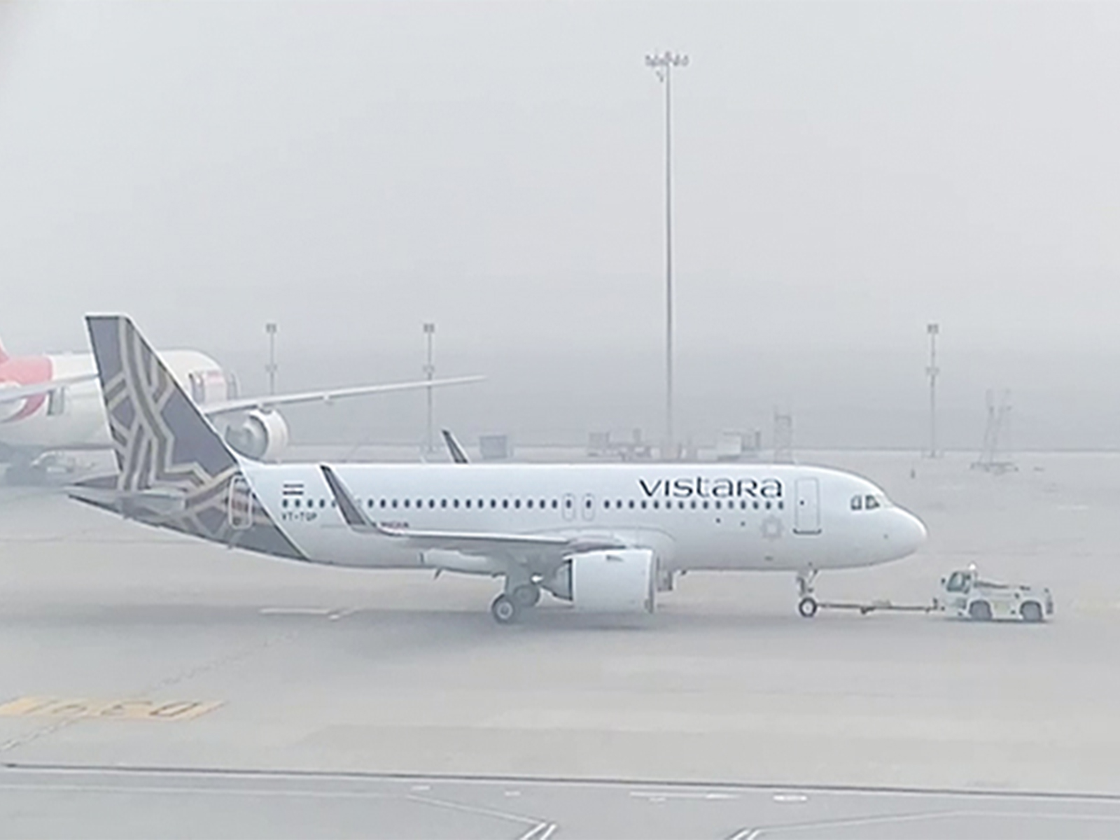 An aircraft awaits take-off at the runway as dense smog reduced visibility and engulfed IGI airport (File Photo/ANI)
