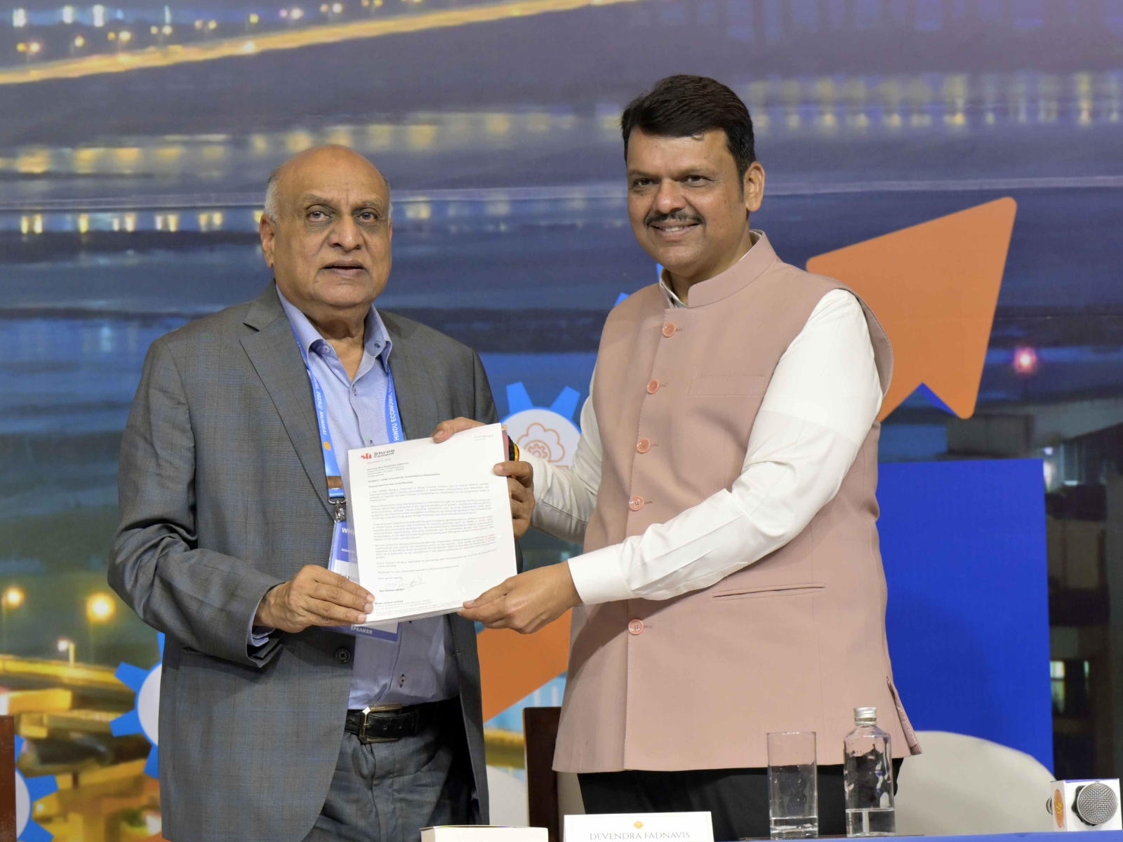 H M Bangur, Chairman, Shree Cement, handing over LoI to invest Rs 2000 cr to Chief Minister, Devendra Fadnavis, at the World Hindu Economic Forum 2025 in Mumbai