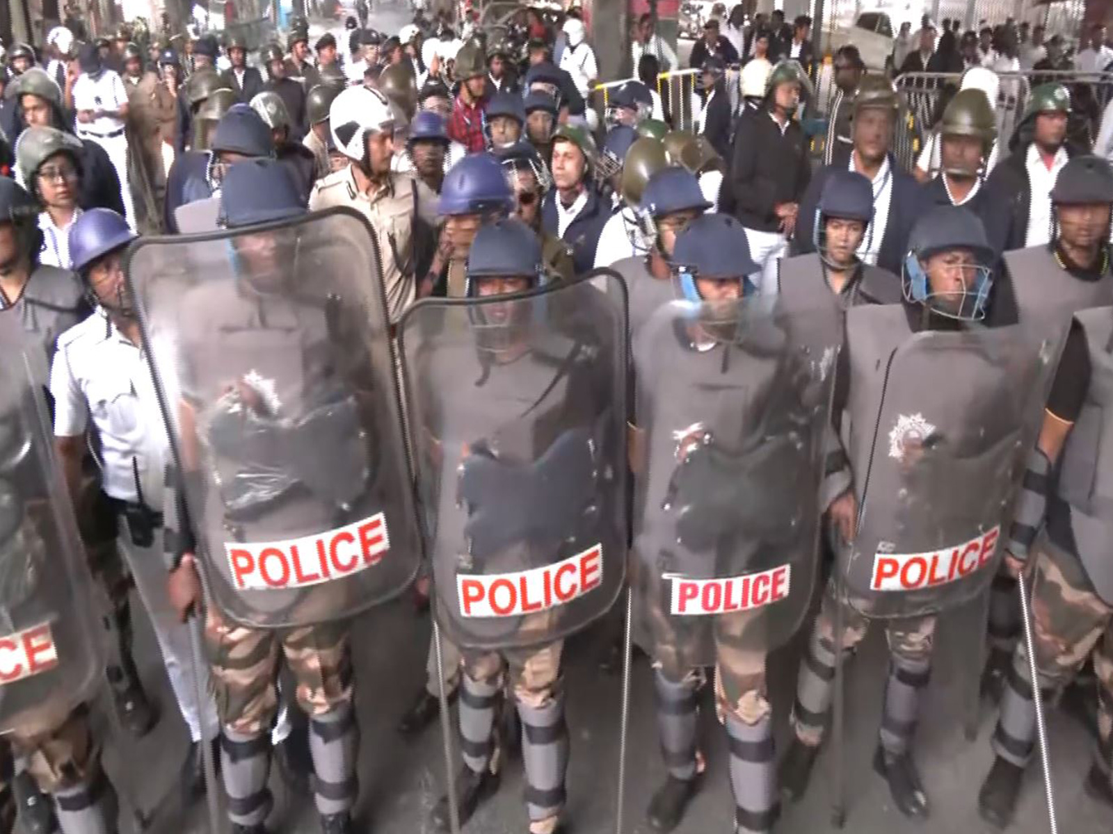 Police personnel stand guard during a protest by Hindu organisations near the Bangladesh Deputy High Commission in Kolkata (Photo/ANI)