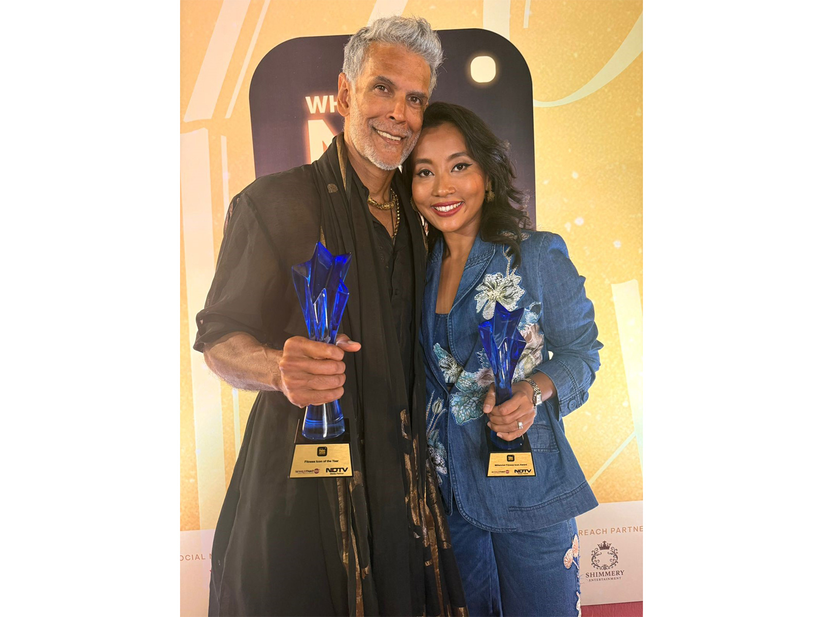Milind Soman with Ankita Konwar at the NDTV Who's Next 2025 Awards, celebrating impact-driven fitness advocacy.