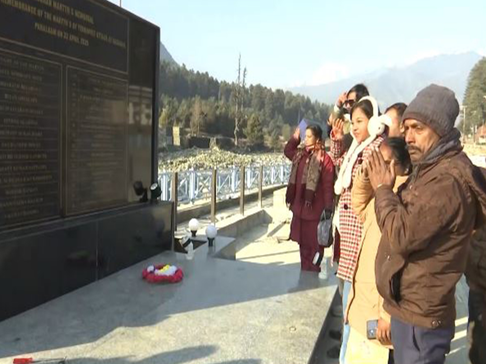 Tourist paying floral tribute to those lost their lives in April 22 Terror attack in Pahalgam  (Photo/ANI)