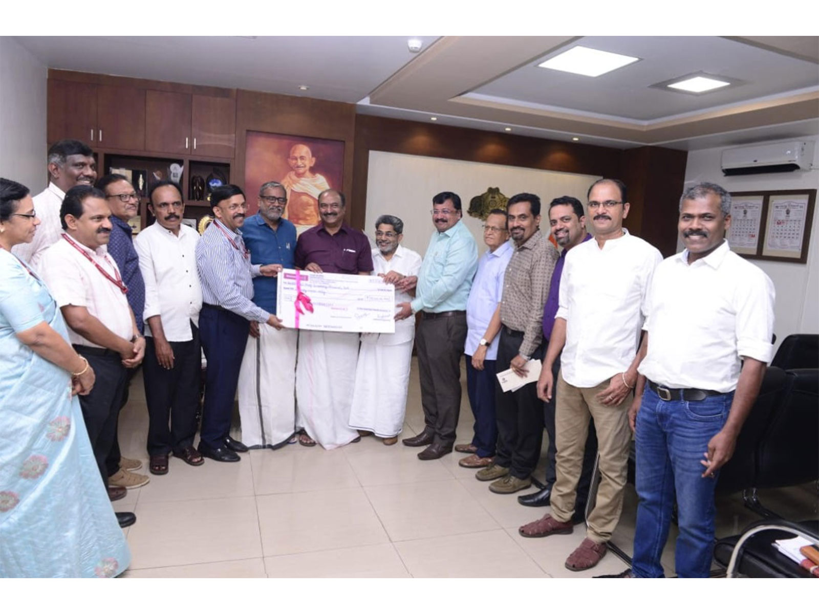 KSFE Dividend Presentation: Finance Minister K.N. Balagopal receiving the Rs. 70 crore dividend for FY 2024-25 from KSFE Chairman K. Varadarajan and MD Dr. S.K. Sanil